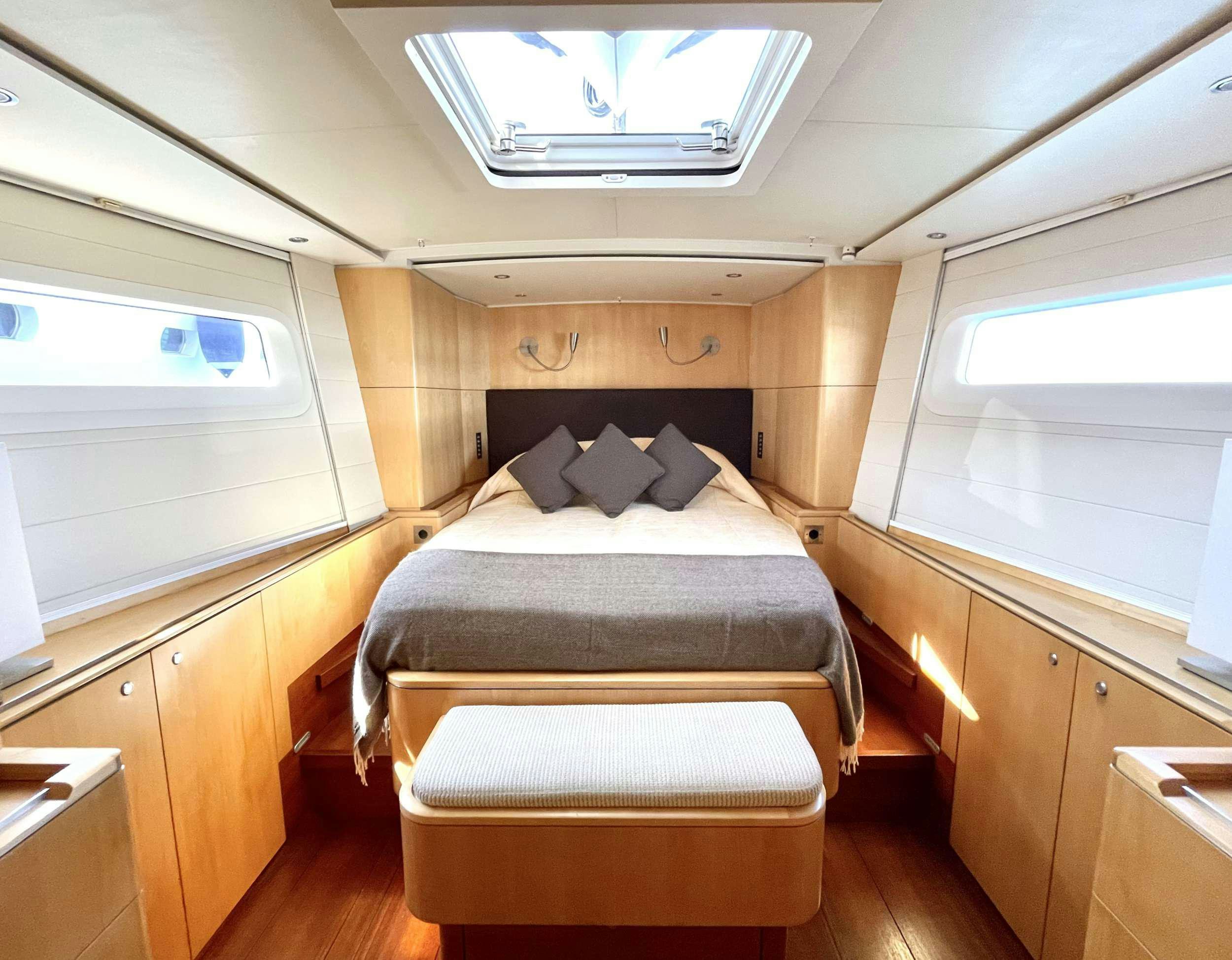 a bed in a room aboard BLACK PEARL II Yacht for Charter