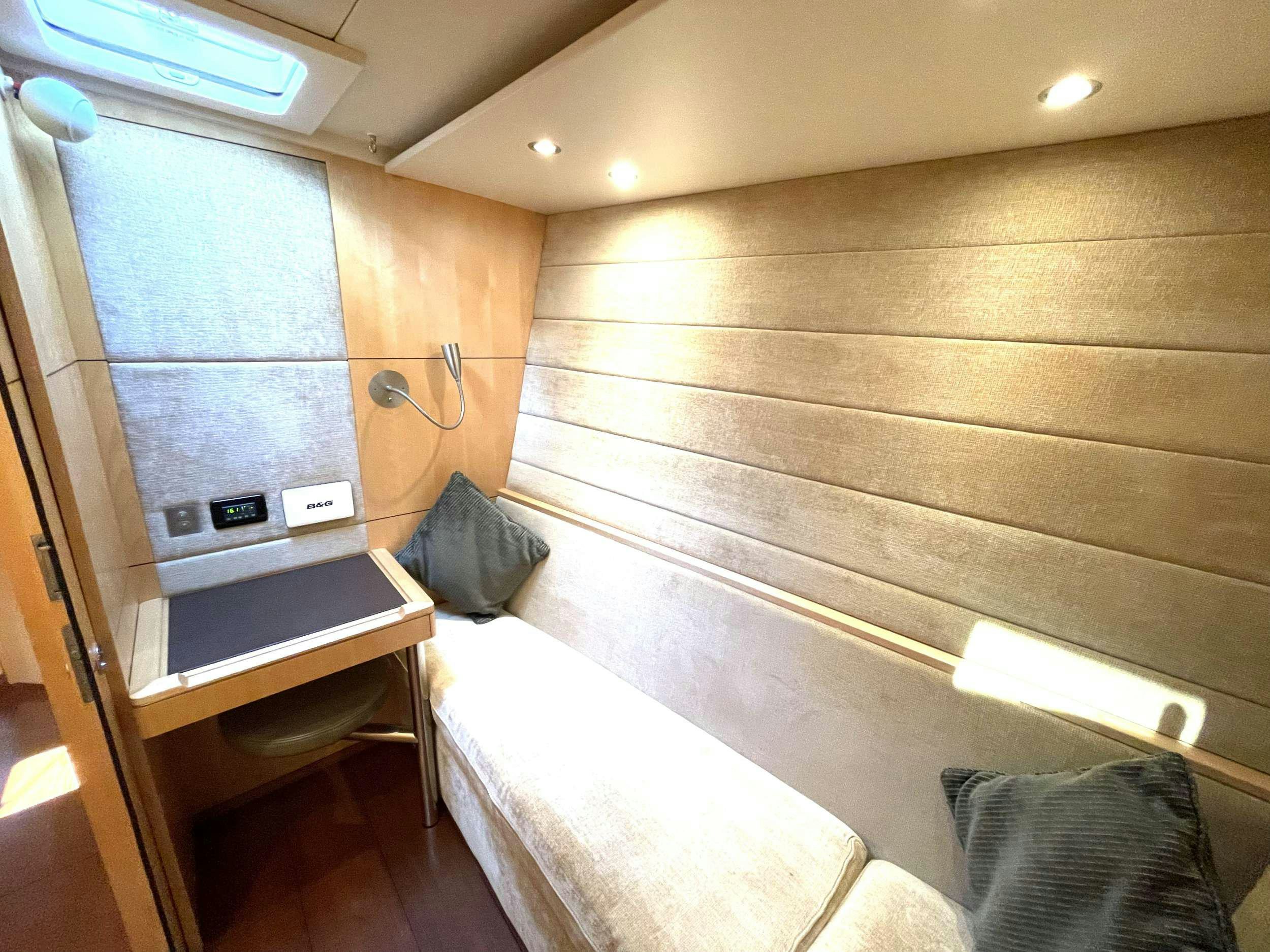 a bed in a room aboard BLACK PEARL II Yacht for Charter
