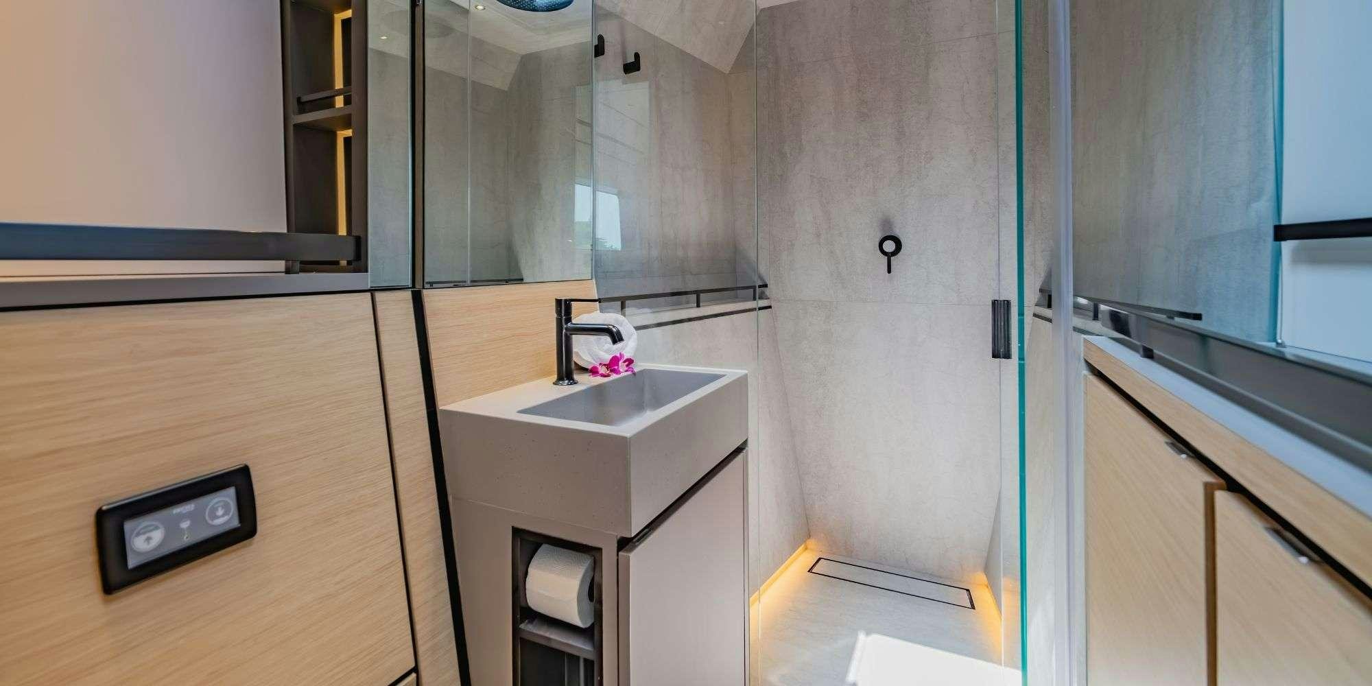 a kitchen with a sink and cabinets aboard JACK Yacht for Charter