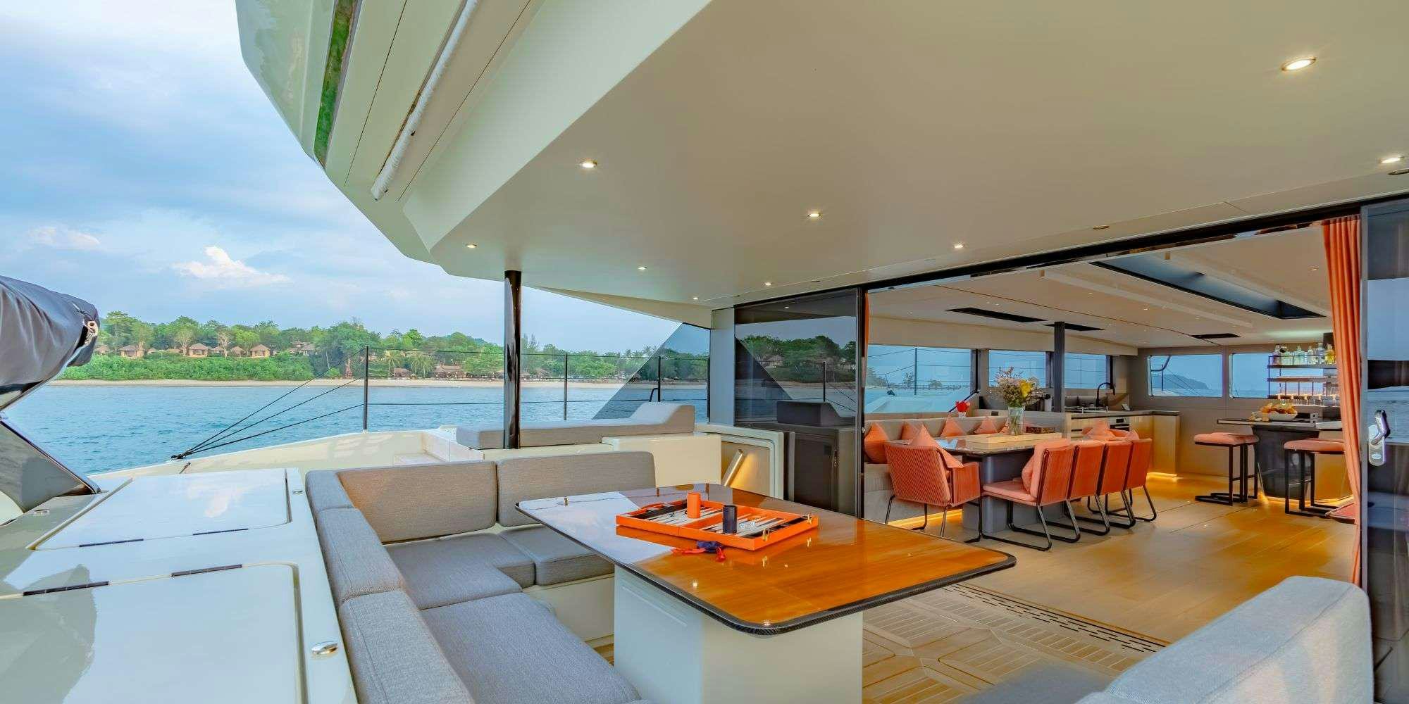 a room with a table and chairs aboard JACK Yacht for Charter