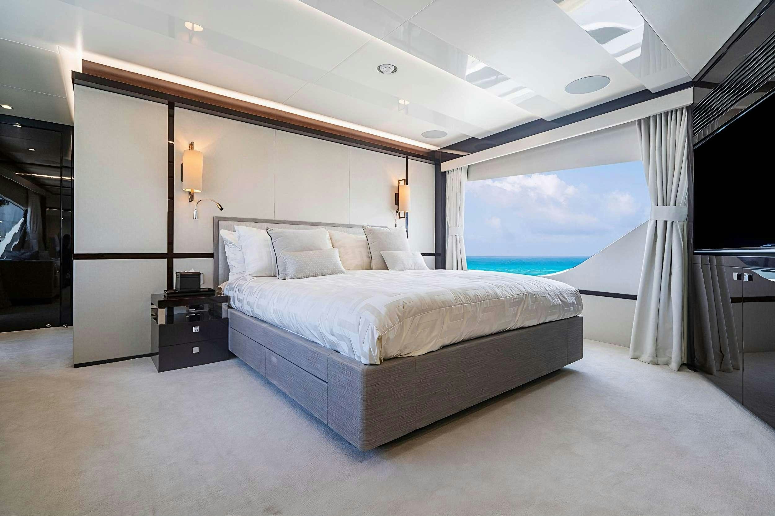 a large bedroom with a large bed aboard QUANTUM Yacht for Charter