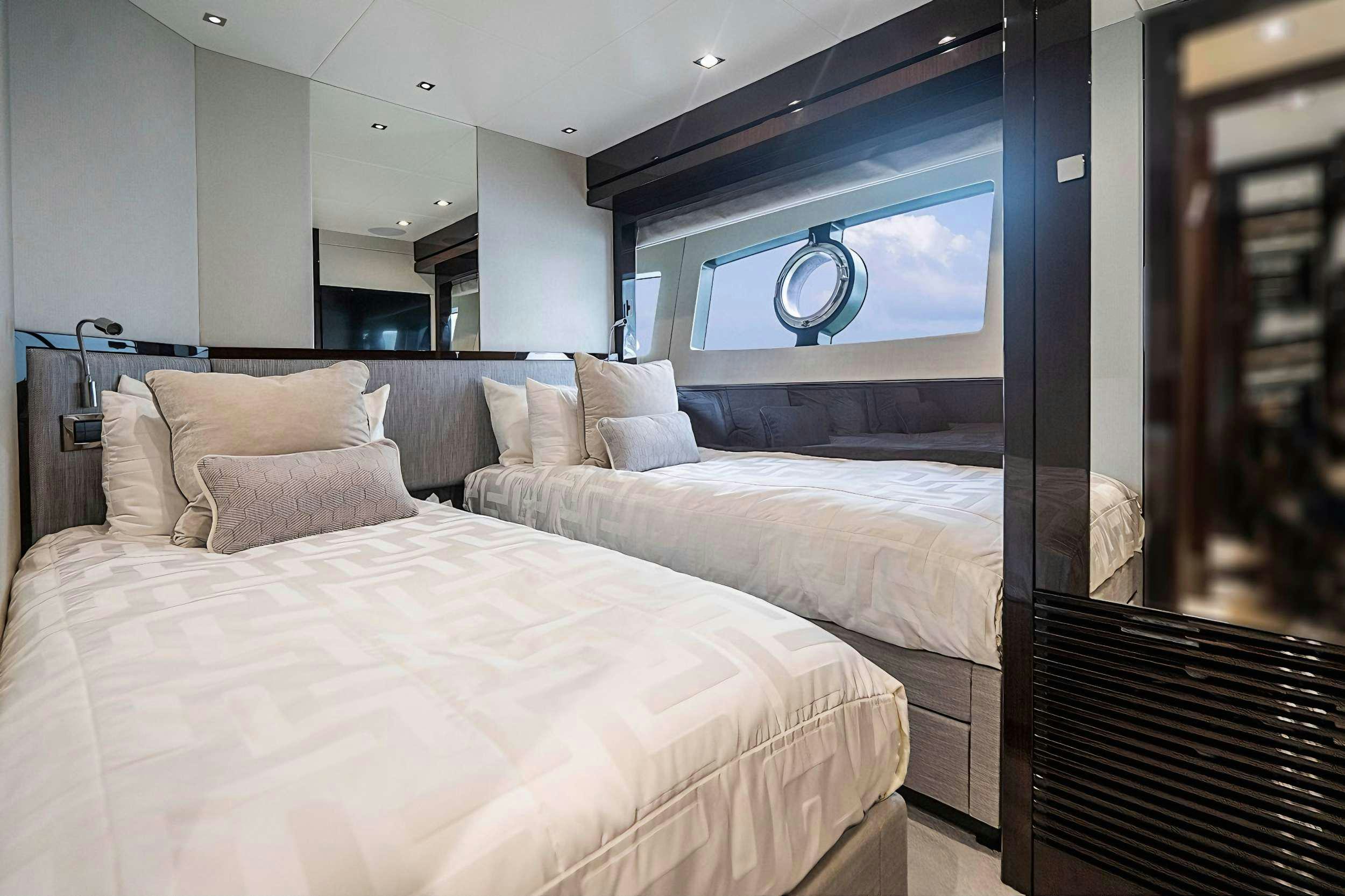 a bed with a white bed aboard QUANTUM Yacht for Charter