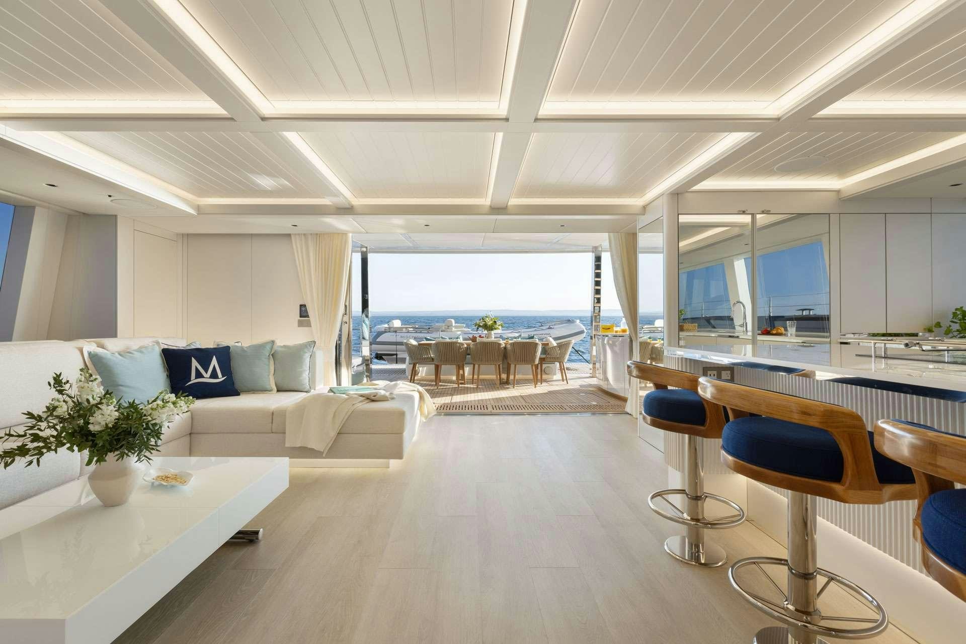 a room with a couch and a table and chairs aboard MISCHIEVOUS Yacht for Charter