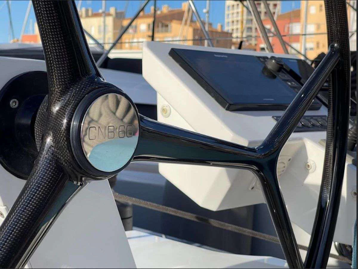 a car with a laptop on the dashboard aboard MAHINA 3 Yacht for Charter