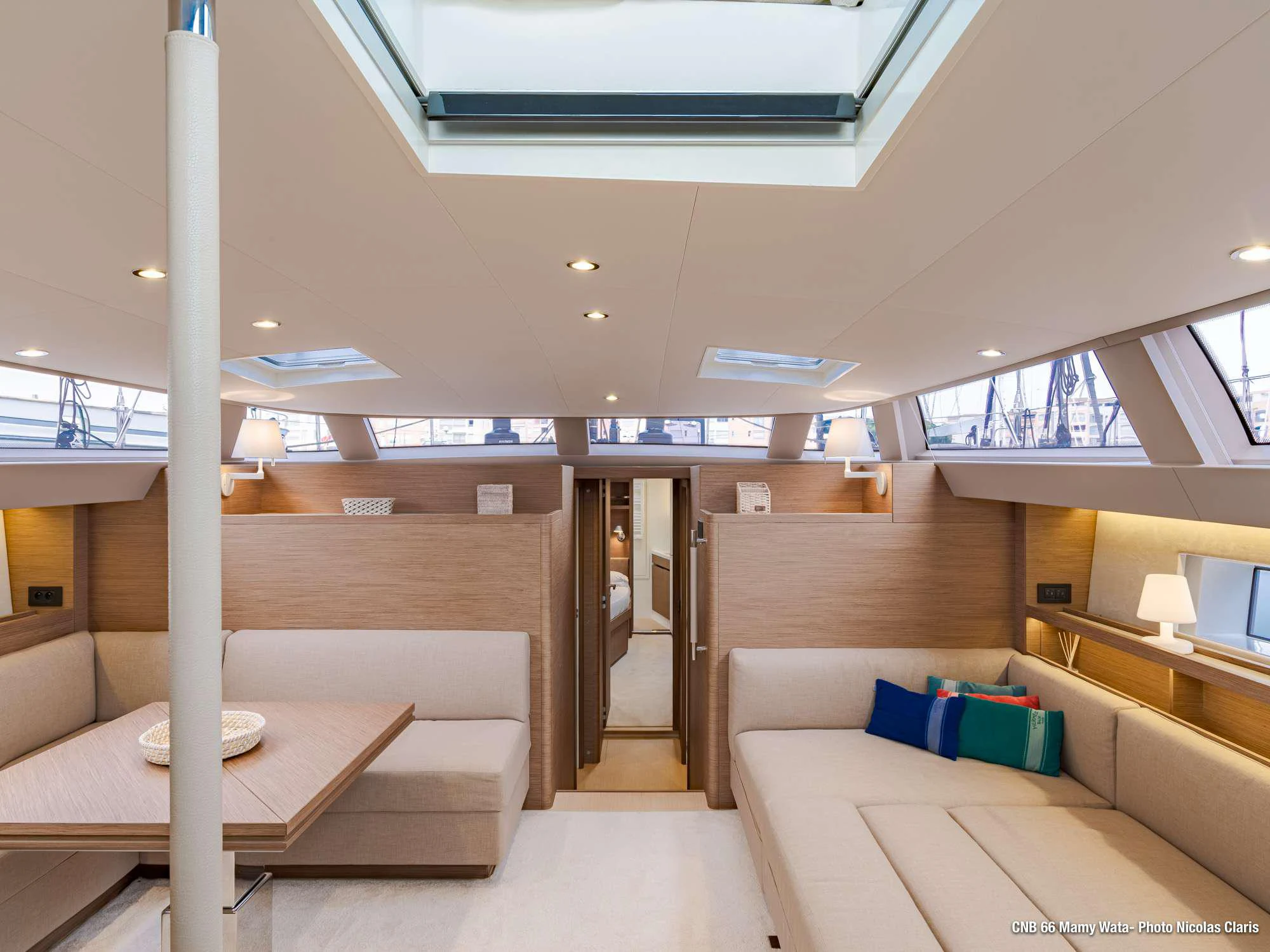 a room with a couch and a table aboard MAHINA 3 Yacht for Charter