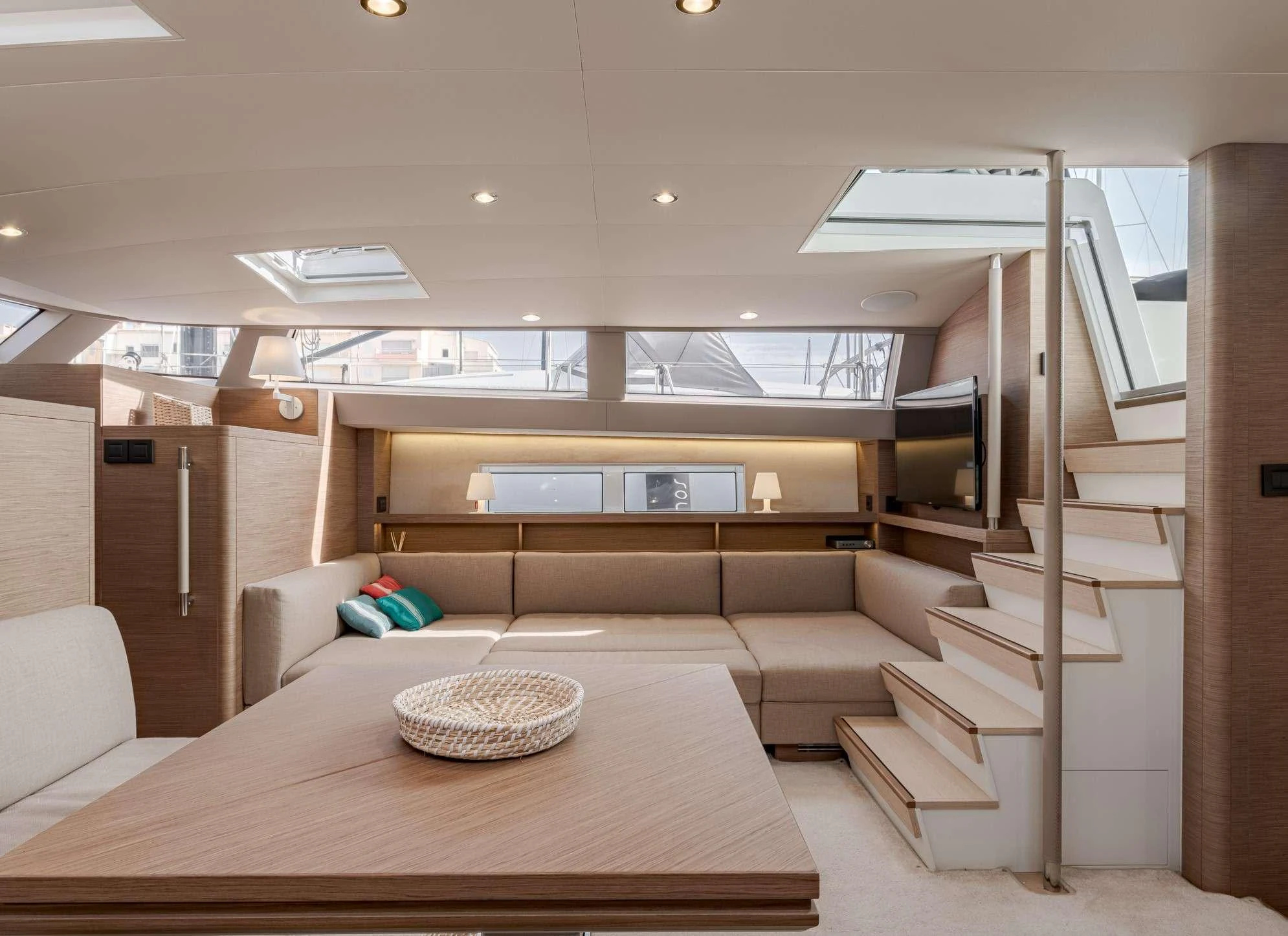 a room with a couch and a table aboard MAHINA 3 Yacht for Charter