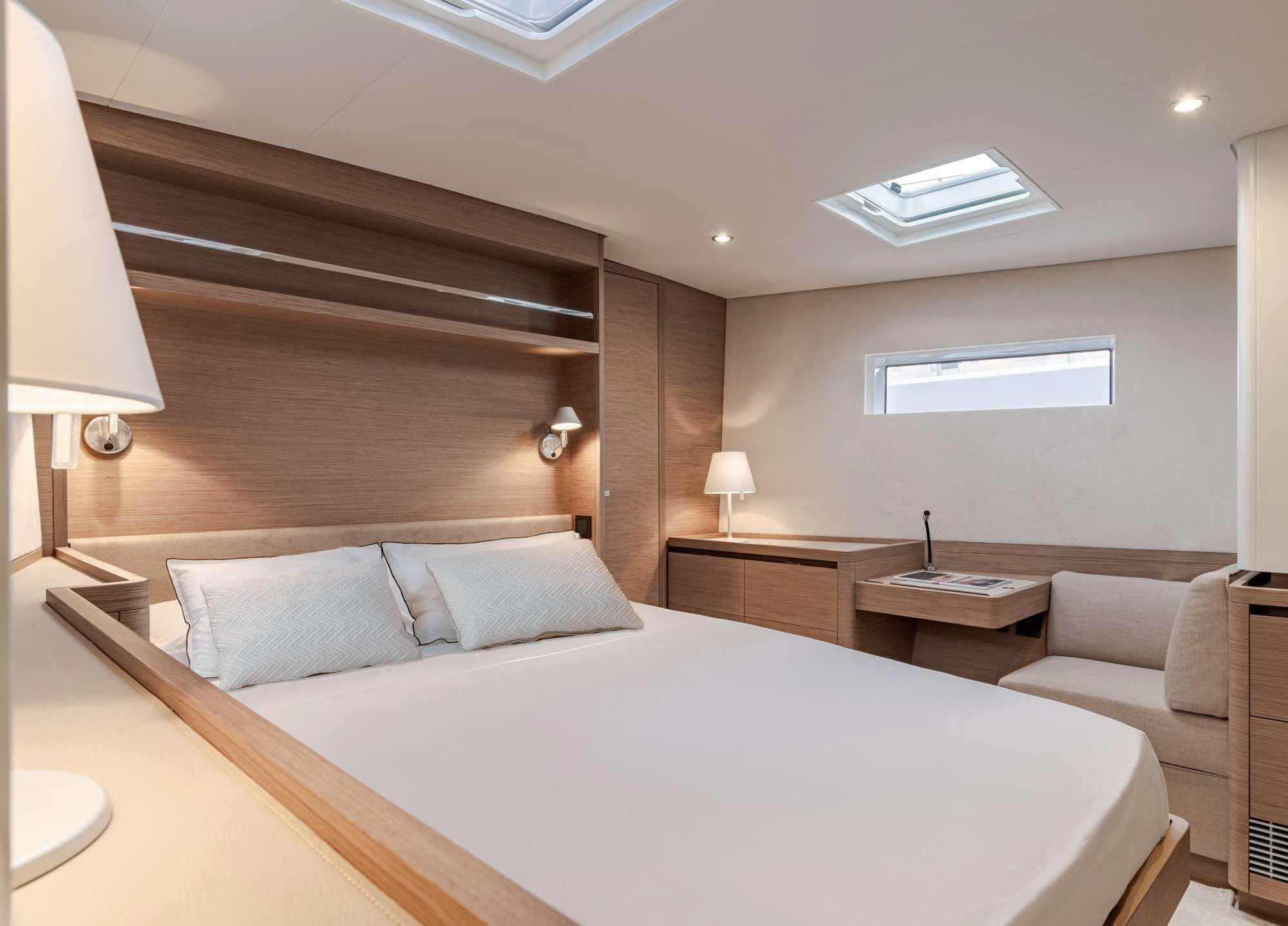 a large bedroom with a bed aboard MAHINA 3 Yacht for Charter