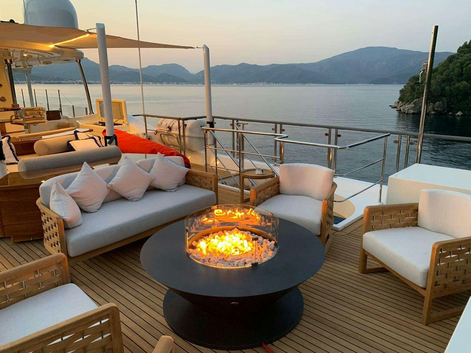 a large outdoor fire pit with a fire pit and a fire pit aboard POLARIS Yacht for Charter