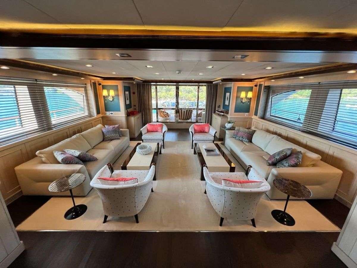 a living room with a large window aboard POLARIS Yacht for Charter