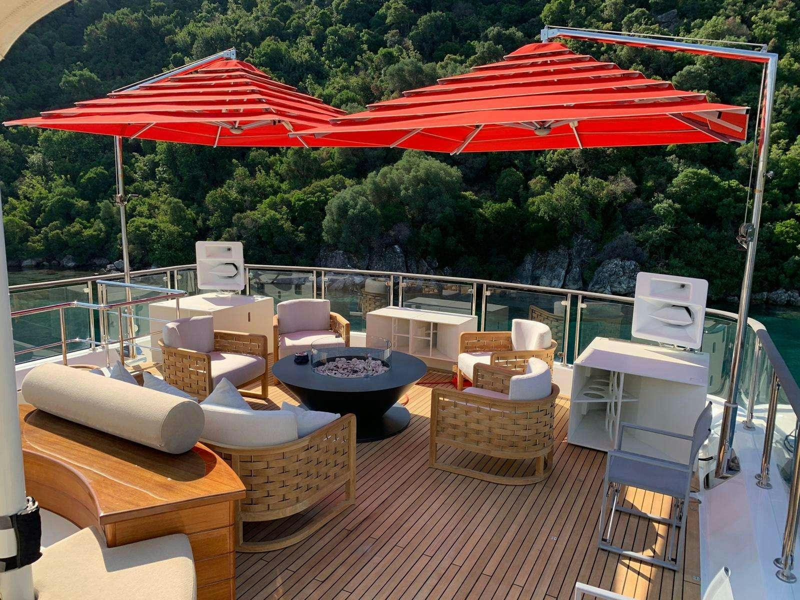 a patio with a table and chairs aboard POLARIS Yacht for Charter