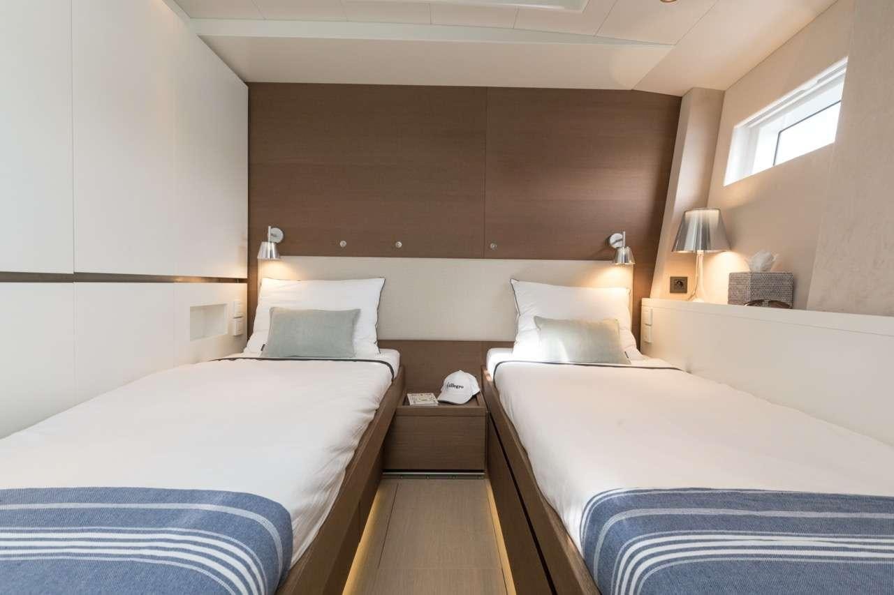 a room with two beds aboard CNB 76 2017 Yacht for Charter
