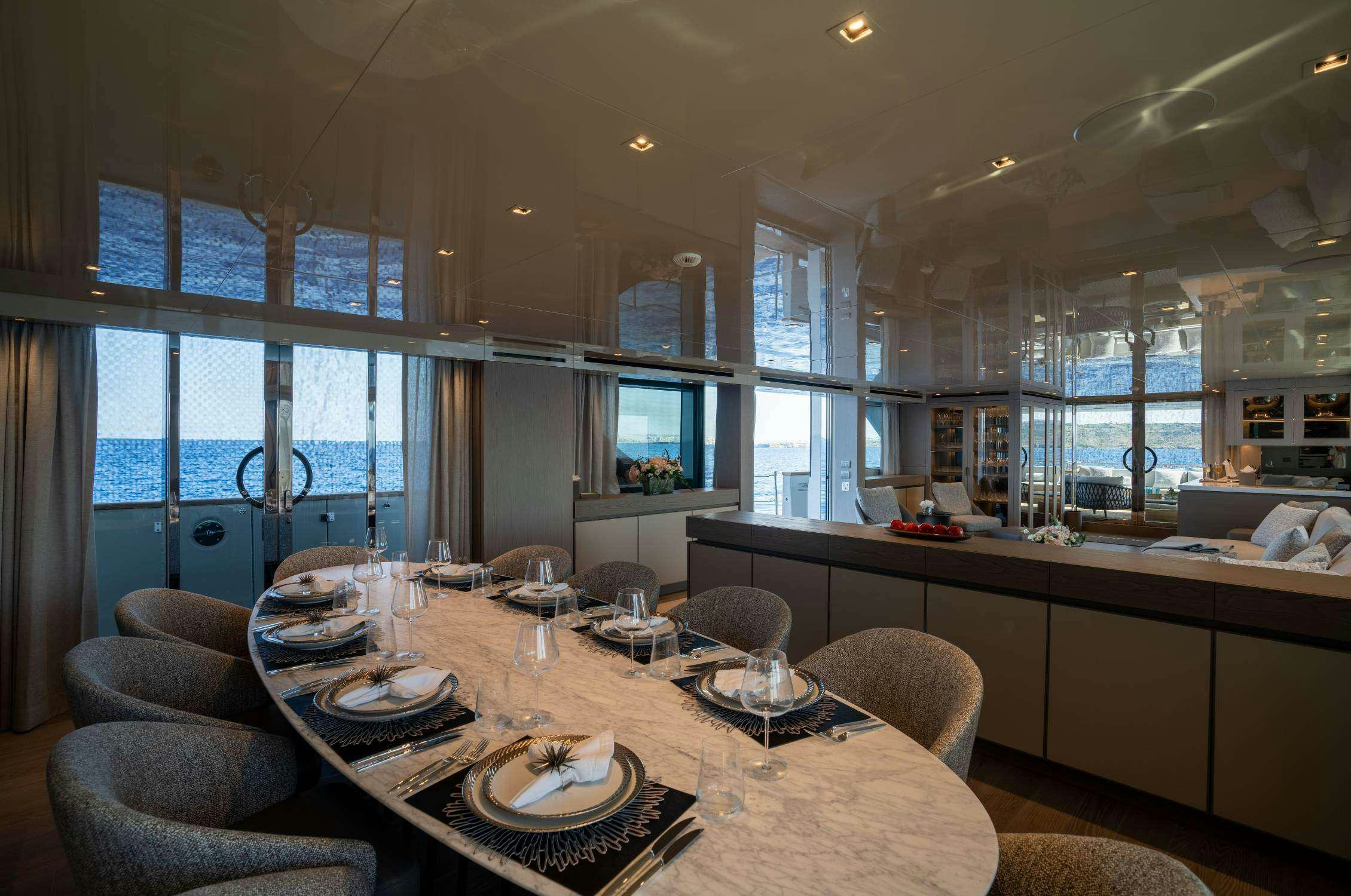 a large kitchen with a dining table aboard LANCE Yacht for Charter