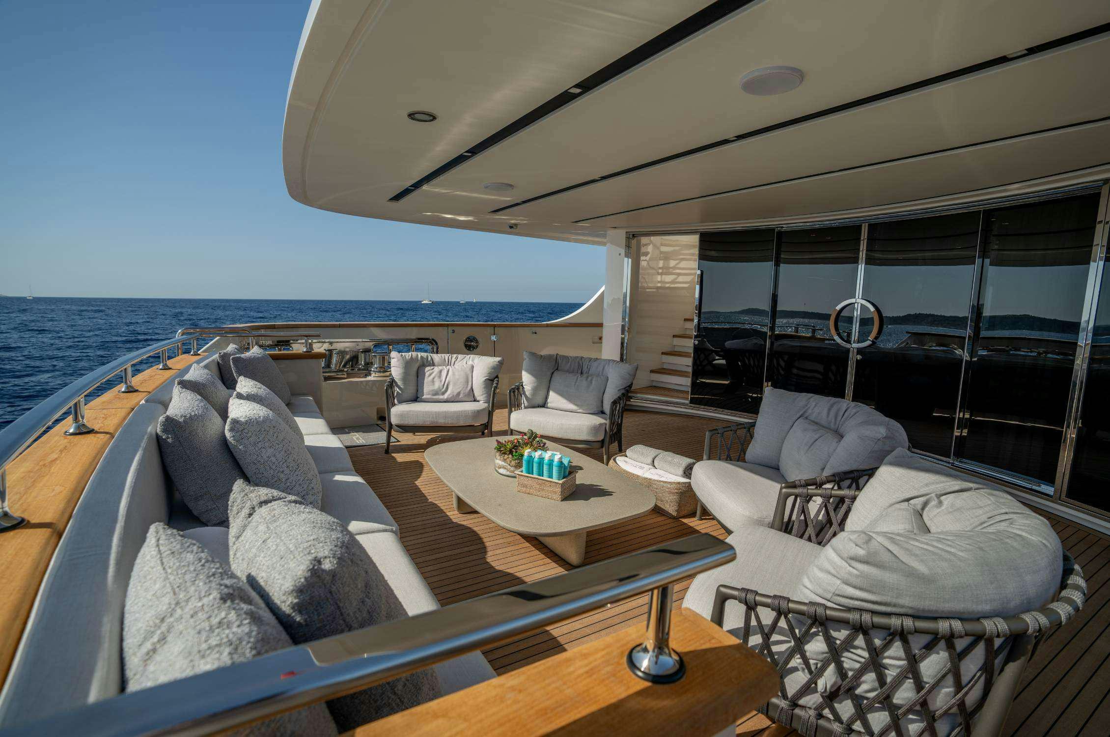 a living room with a large ocean aboard LANCE Yacht for Charter
