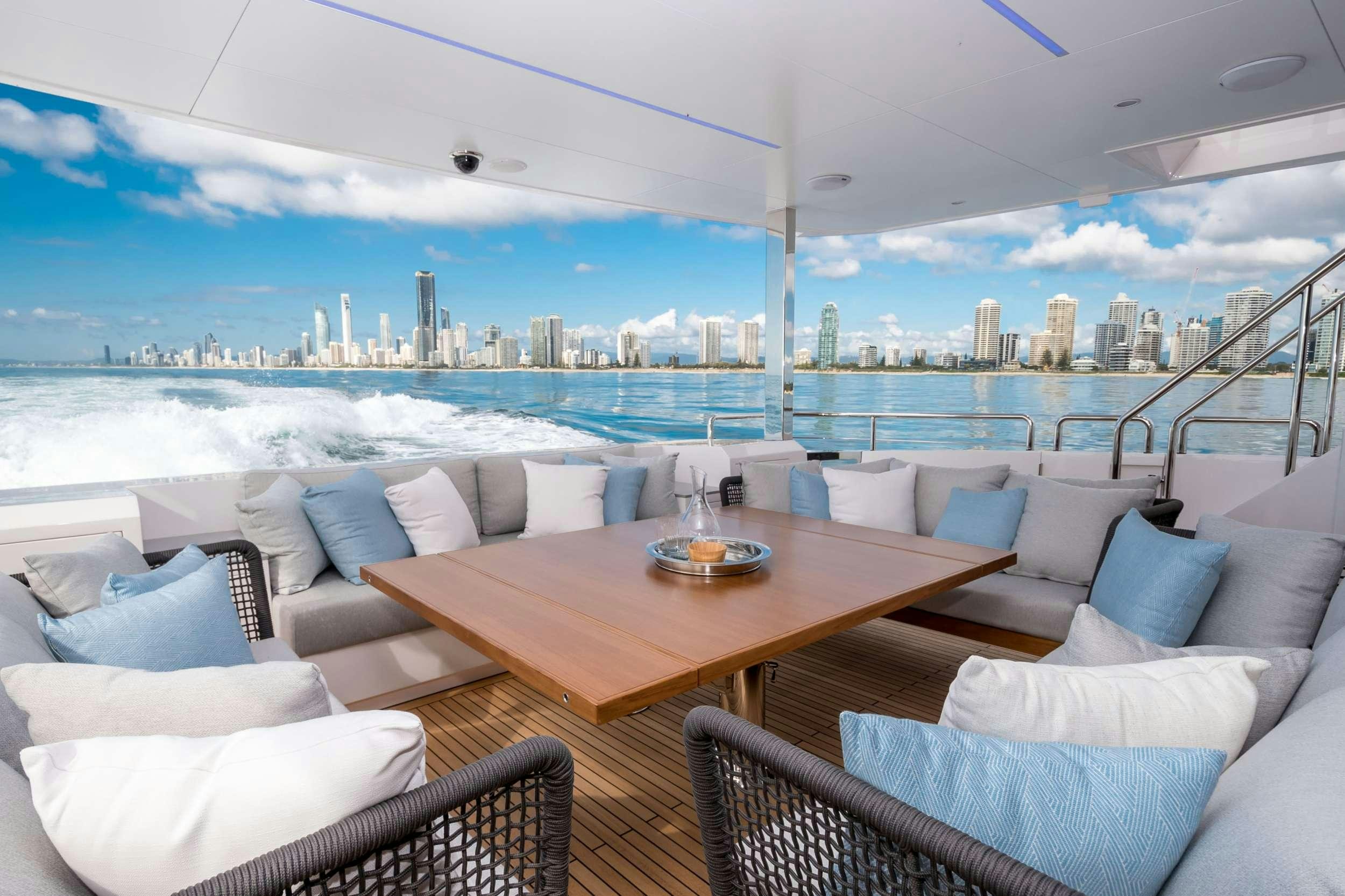 a room with a table and chairs aboard AURA Yacht for Charter