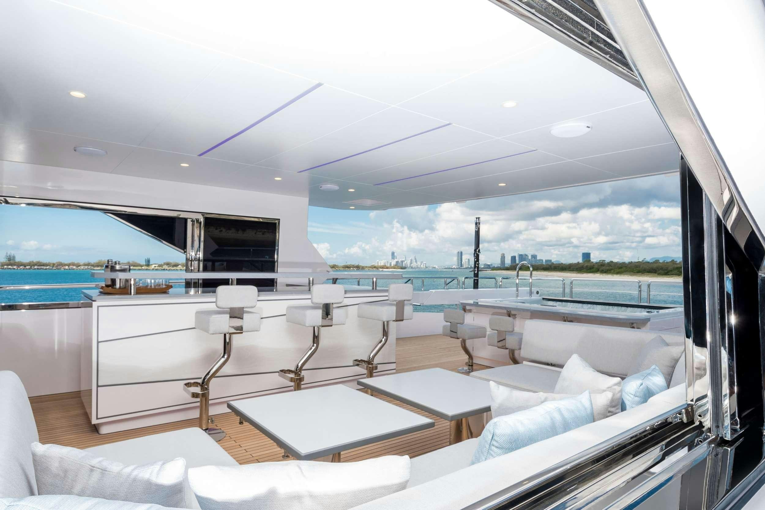 a room with a view of the ocean and the ocean aboard AURA Yacht for Charter