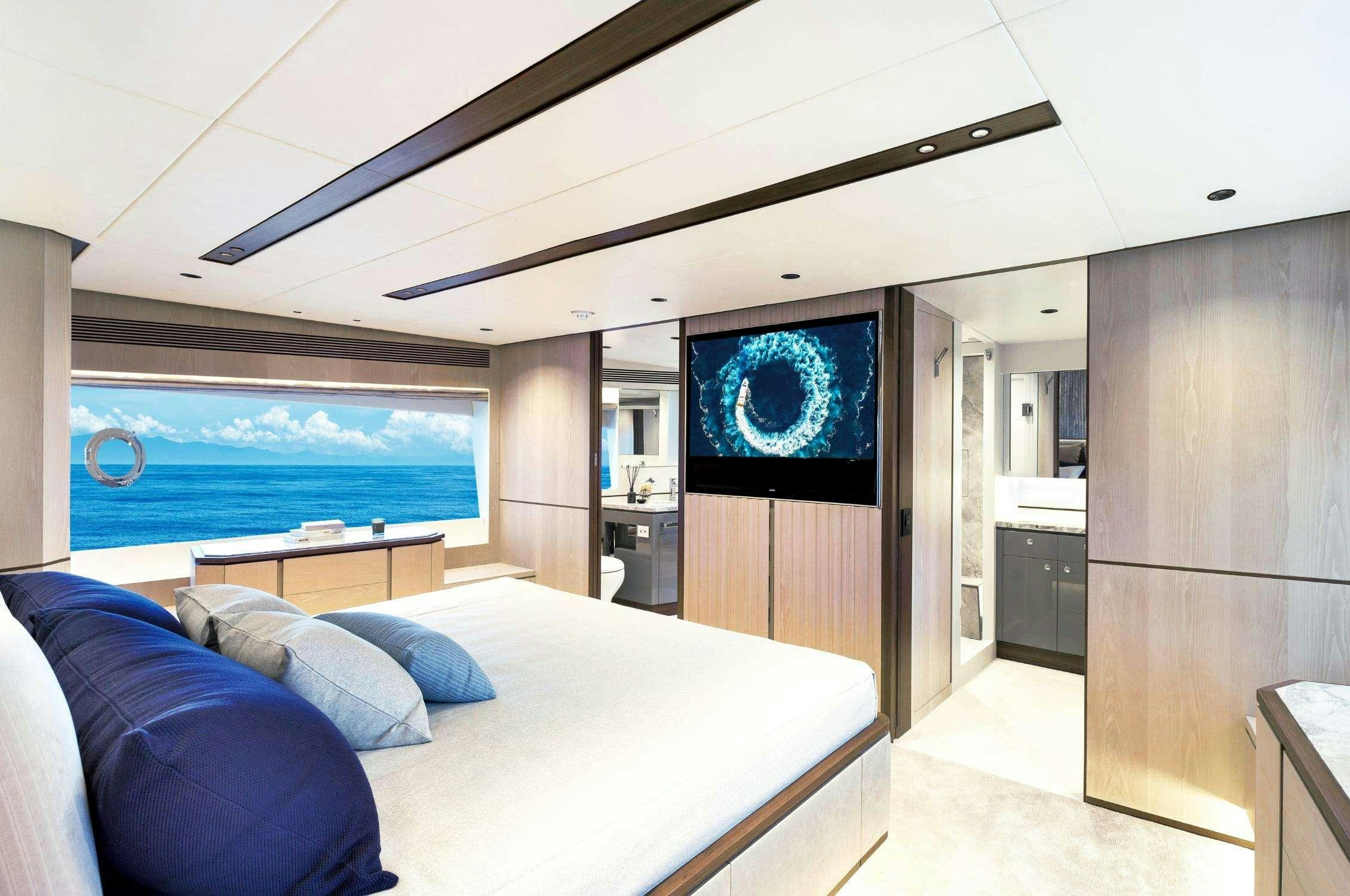 a bedroom with a large bed aboard AURA Yacht for Charter