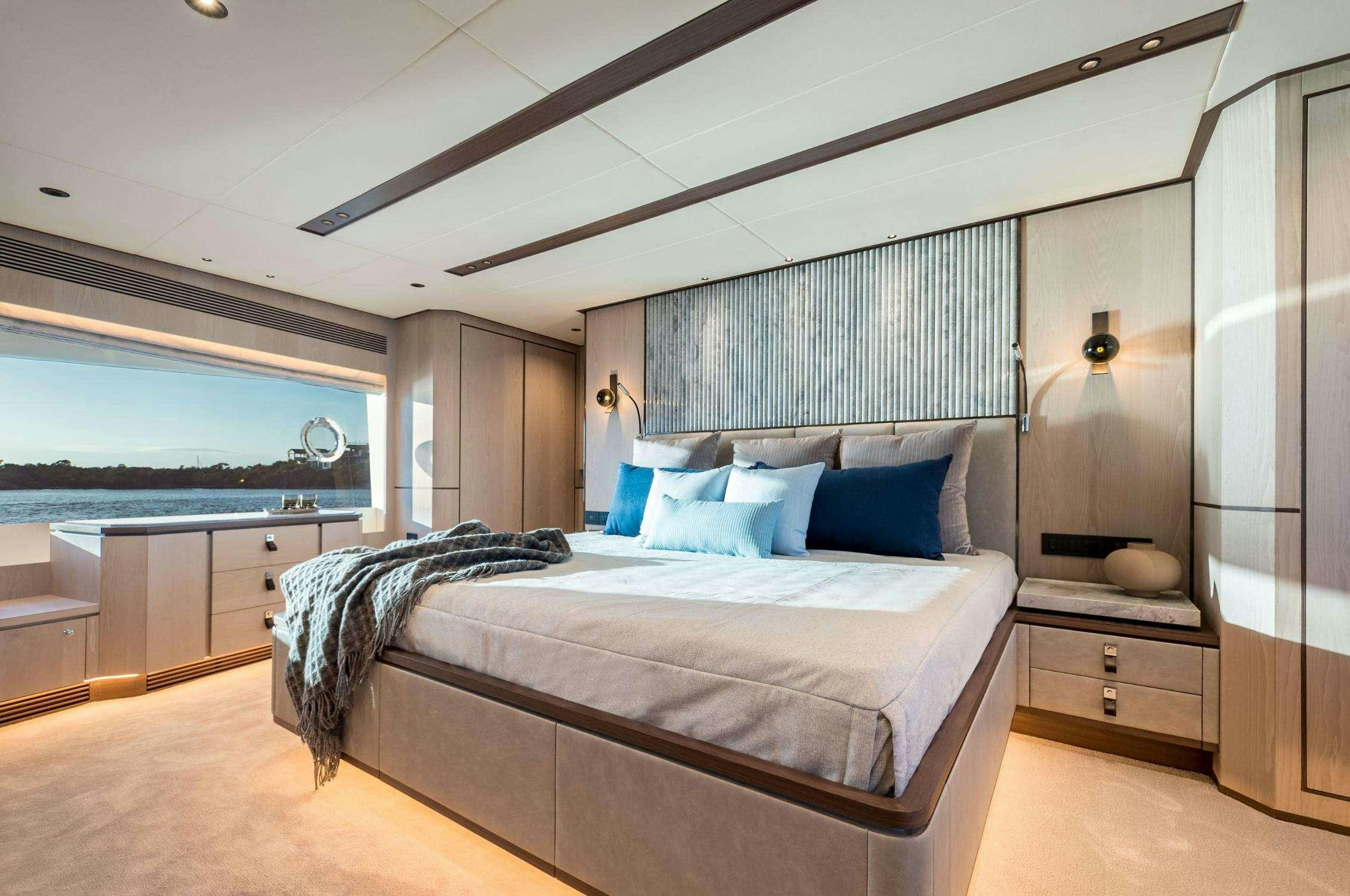 a bedroom with a large bed aboard AURA Yacht for Charter