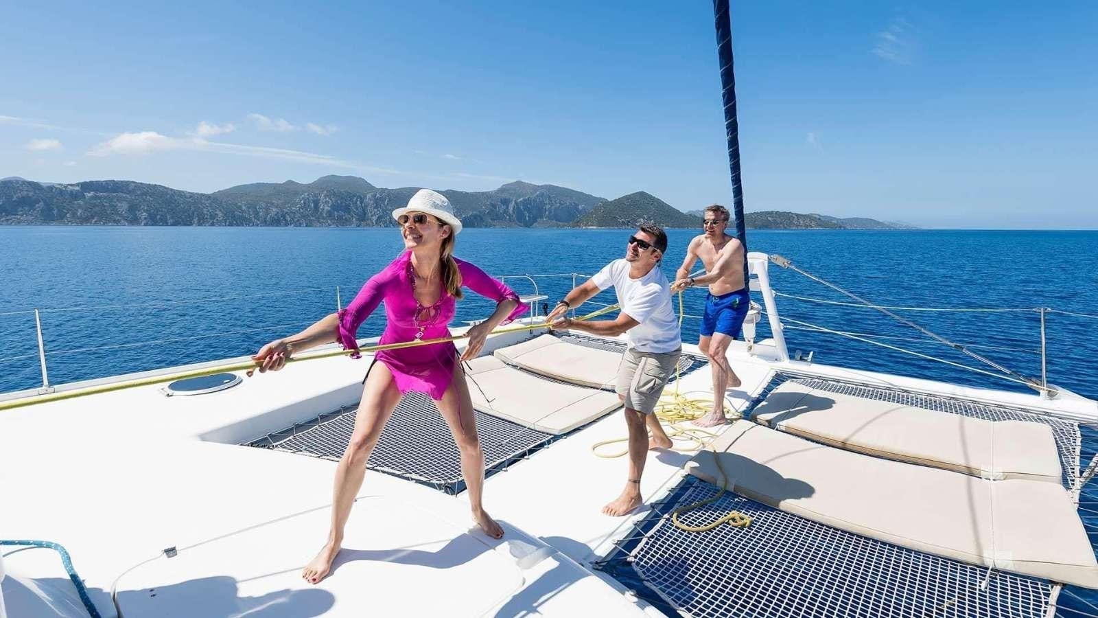 a group of people on a boat aboard ZORBA CAT Yacht for Charter