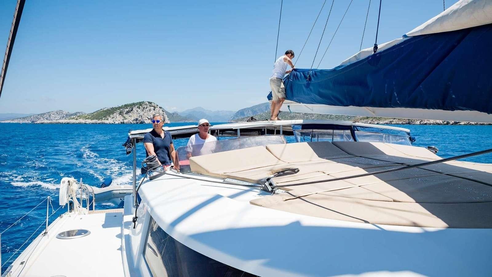 a group of people on a boat aboard ZORBA CAT Yacht for Charter