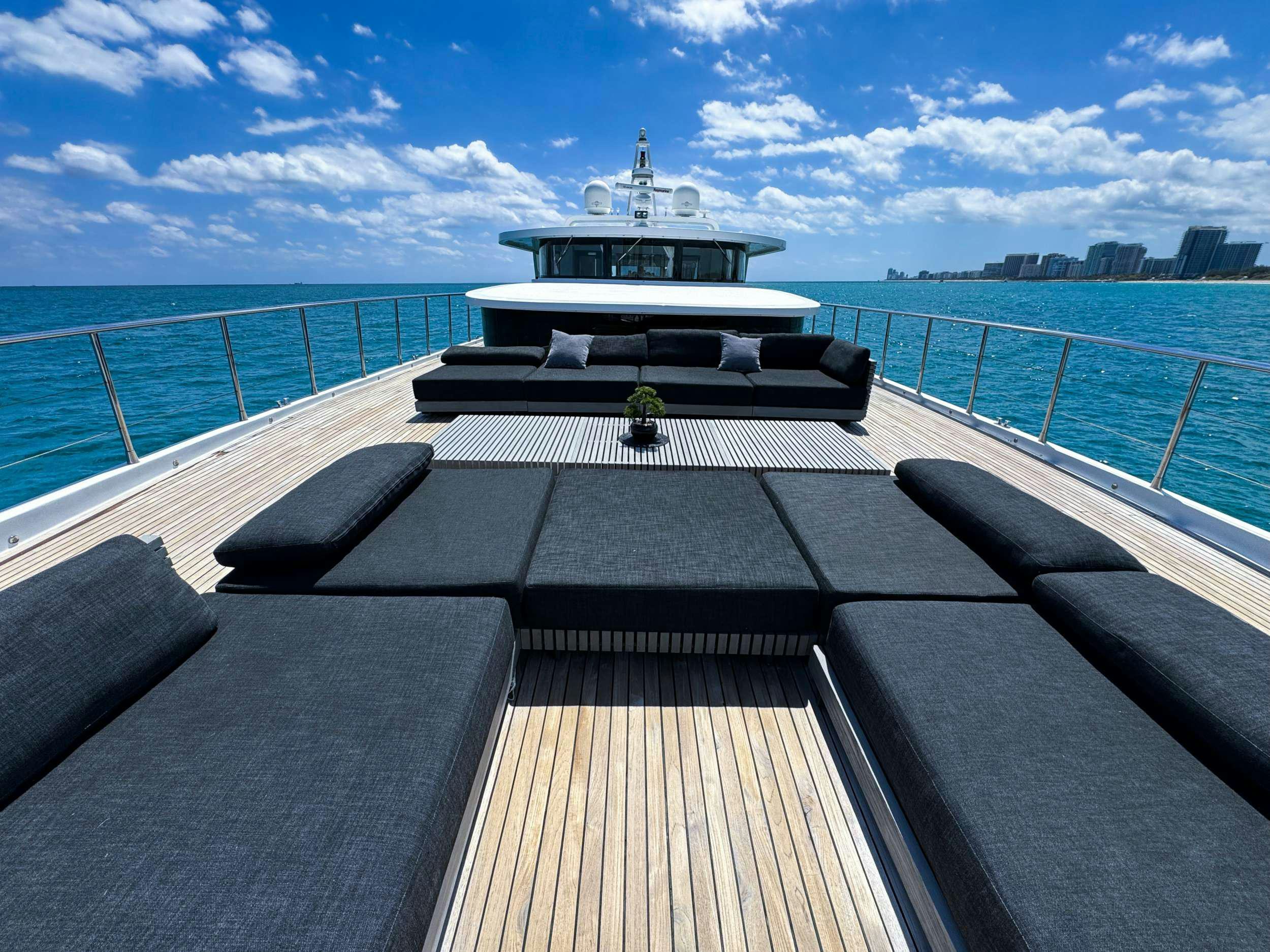 a deck with a boat on it aboard PRIVILEGE Yacht for Charter