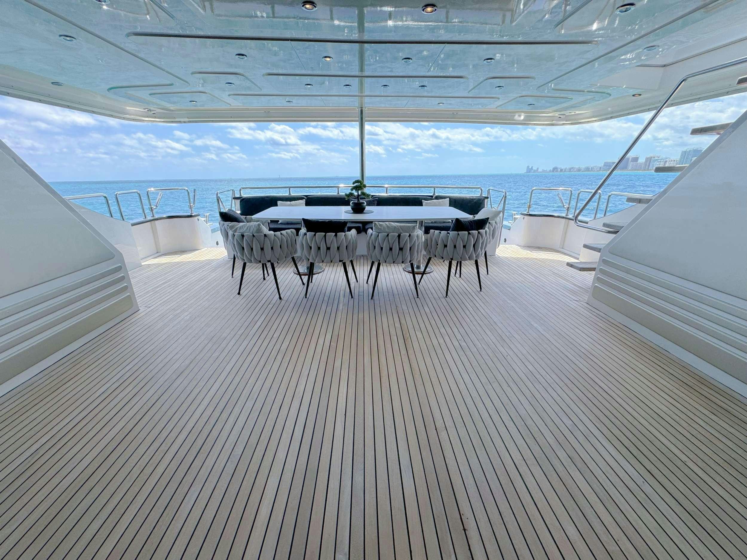 a room with a table and chairs aboard PRIVILEGE Yacht for Charter
