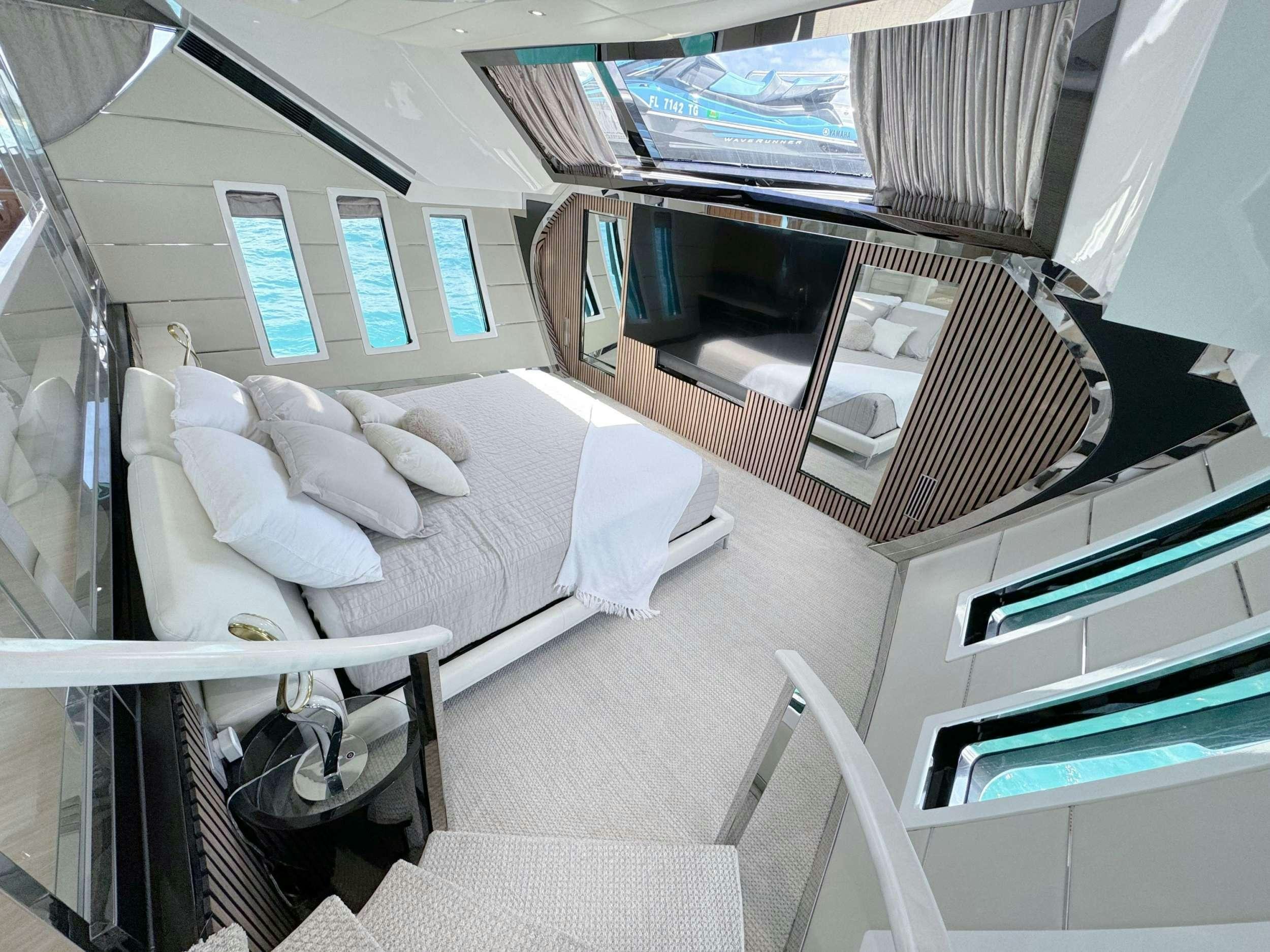 a hospital room with a bed and a laptop aboard PRIVILEGE Yacht for Charter