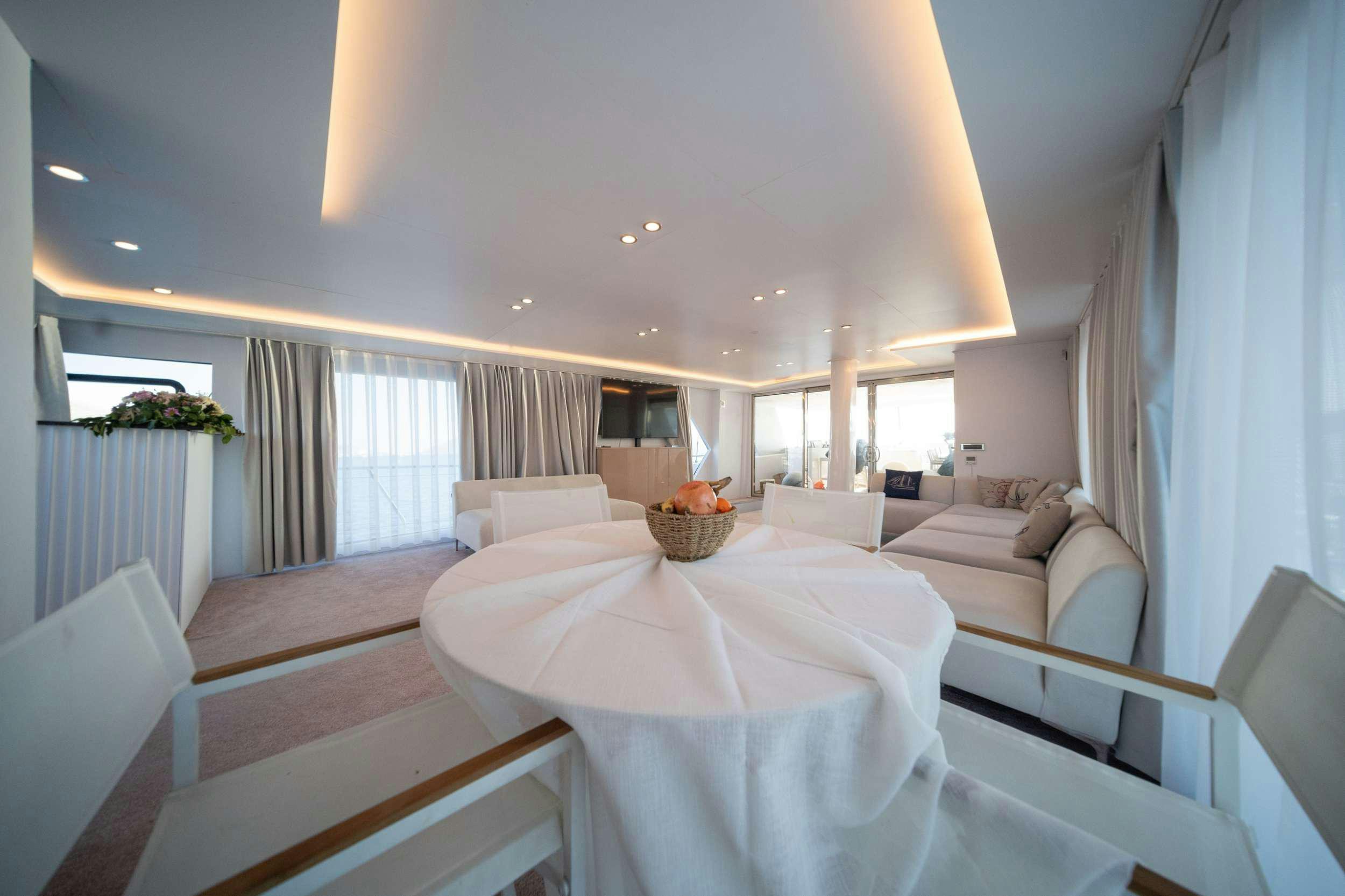 a room with a bed and a table aboard S4 Yacht for Charter