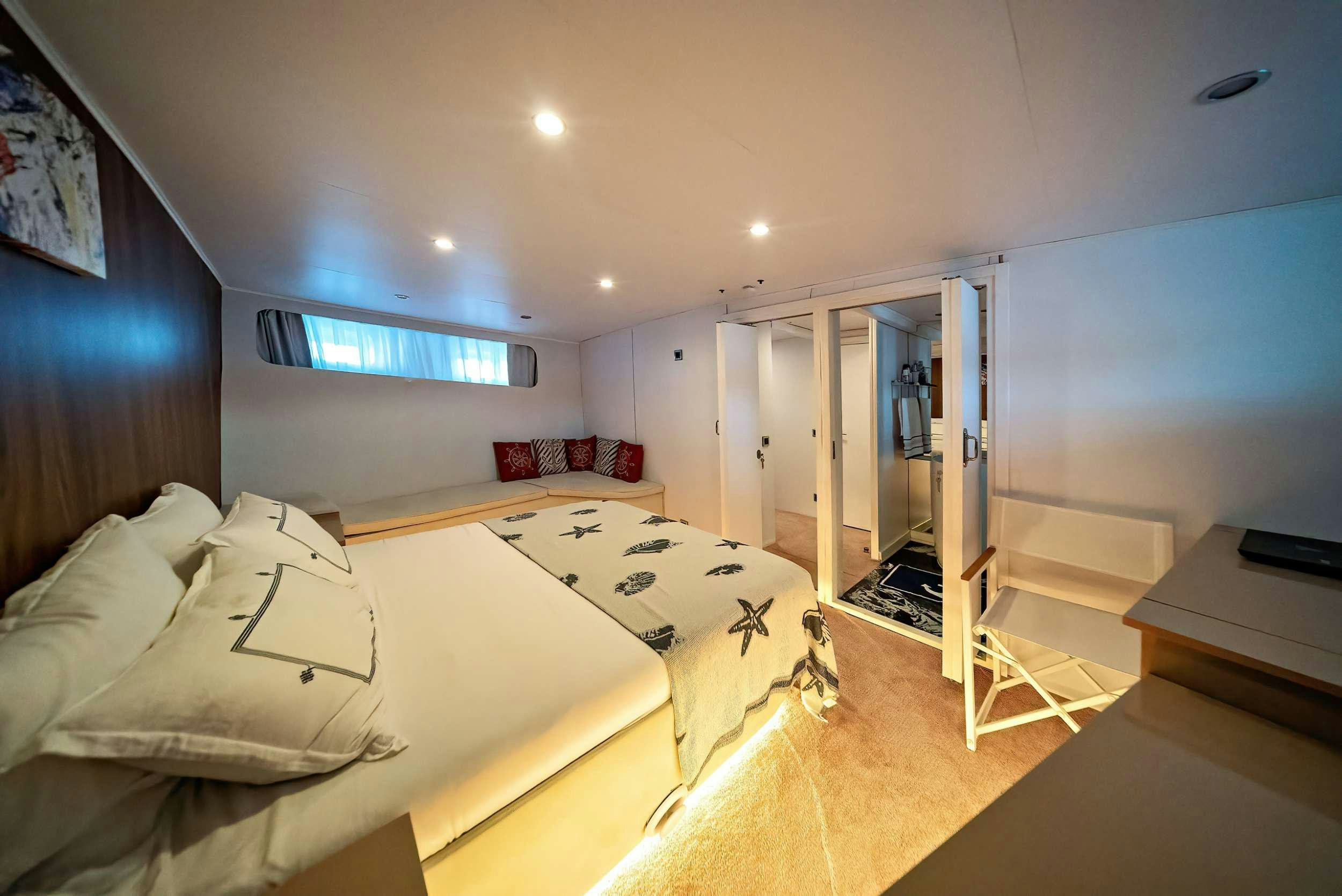 a bedroom with two beds aboard S4 Yacht for Charter