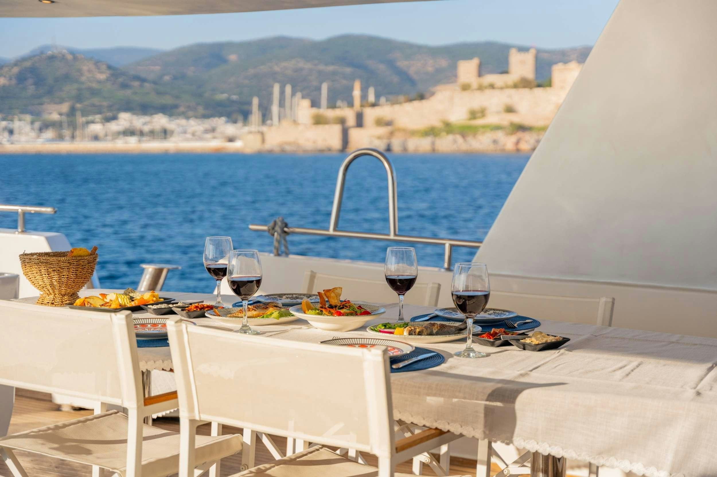 a table set for a meal on a boat aboard S4 Yacht for Charter