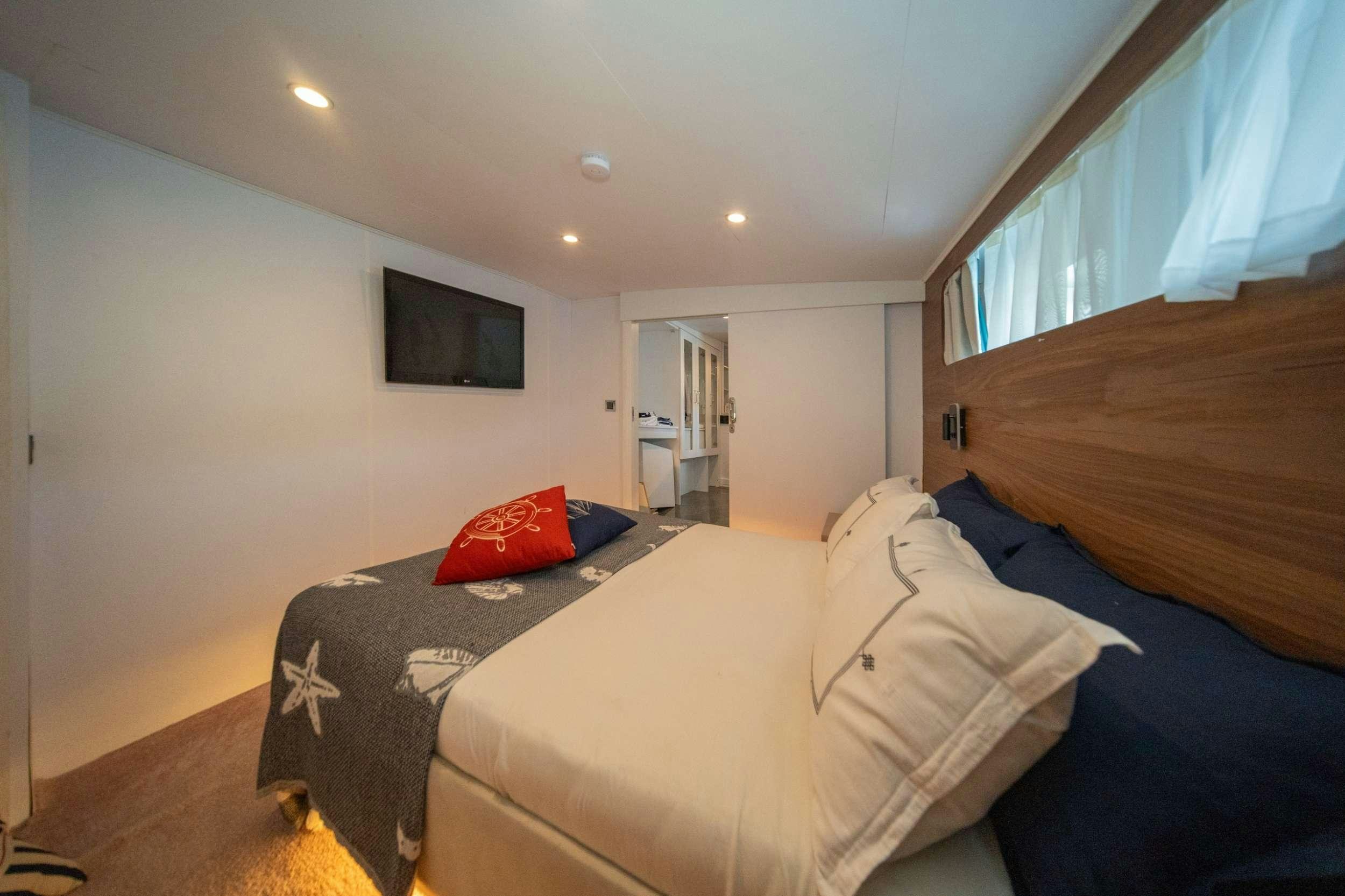 a bedroom with two beds aboard S4 Yacht for Charter