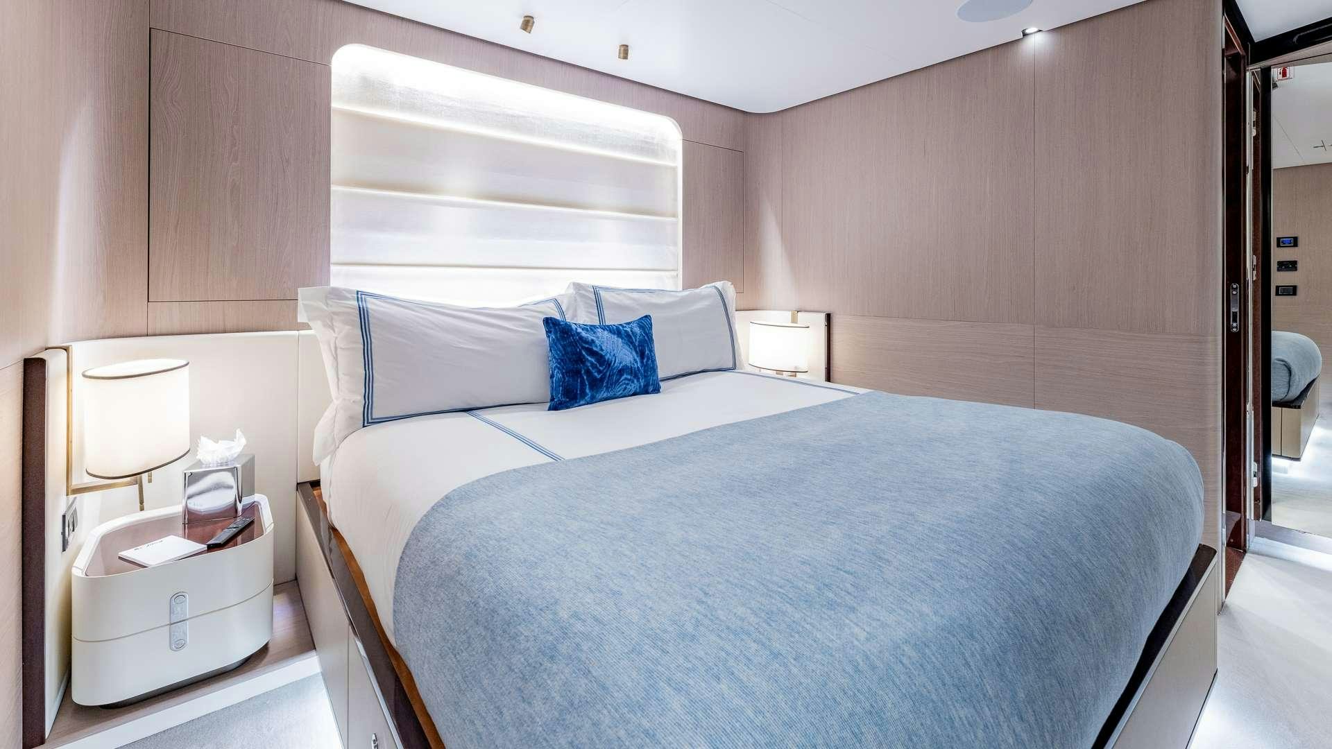 a bed in a room aboard 4 PLAY Yacht for Charter