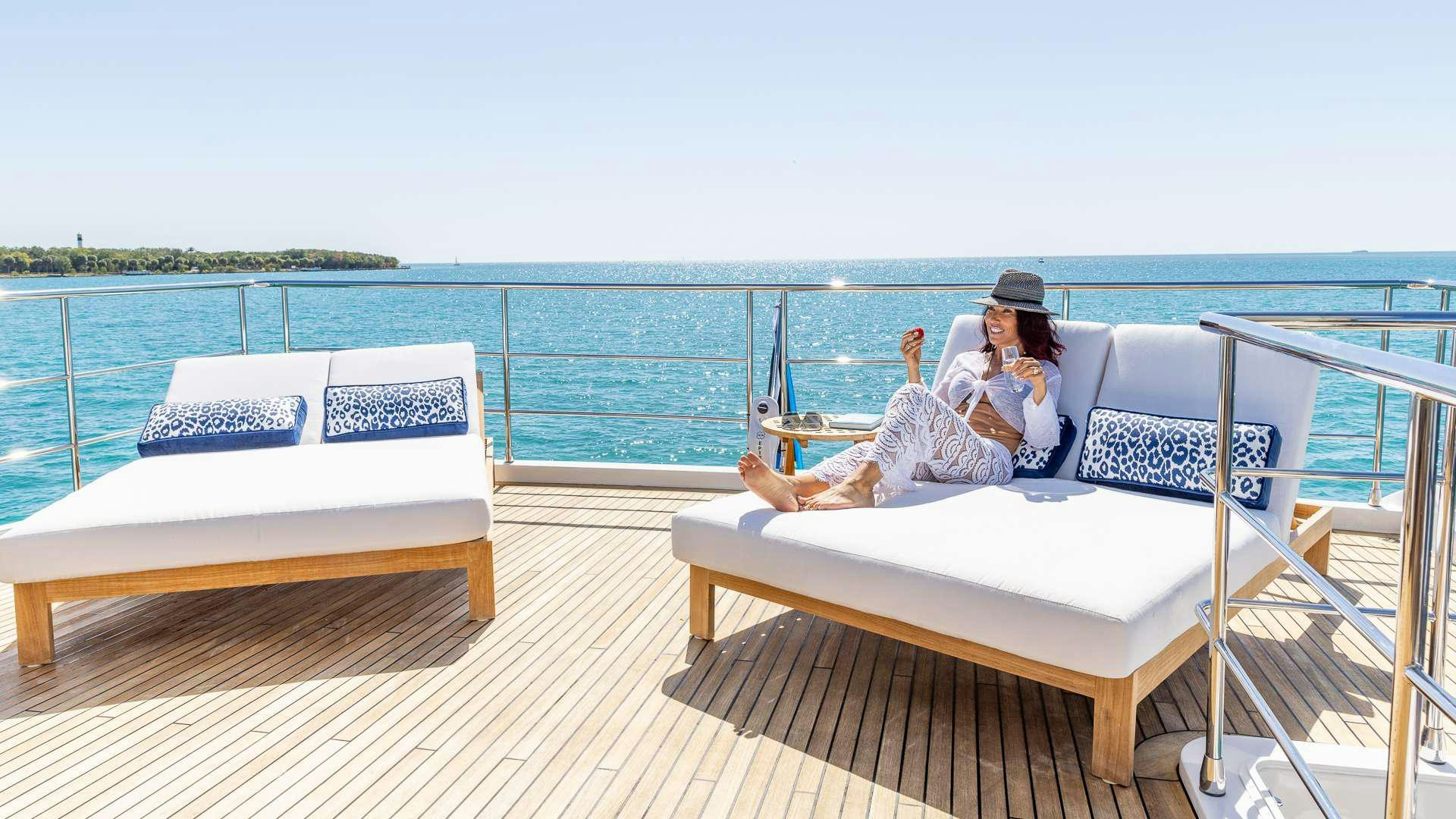 a person sitting on a boat aboard 4 PLAY Yacht for Charter