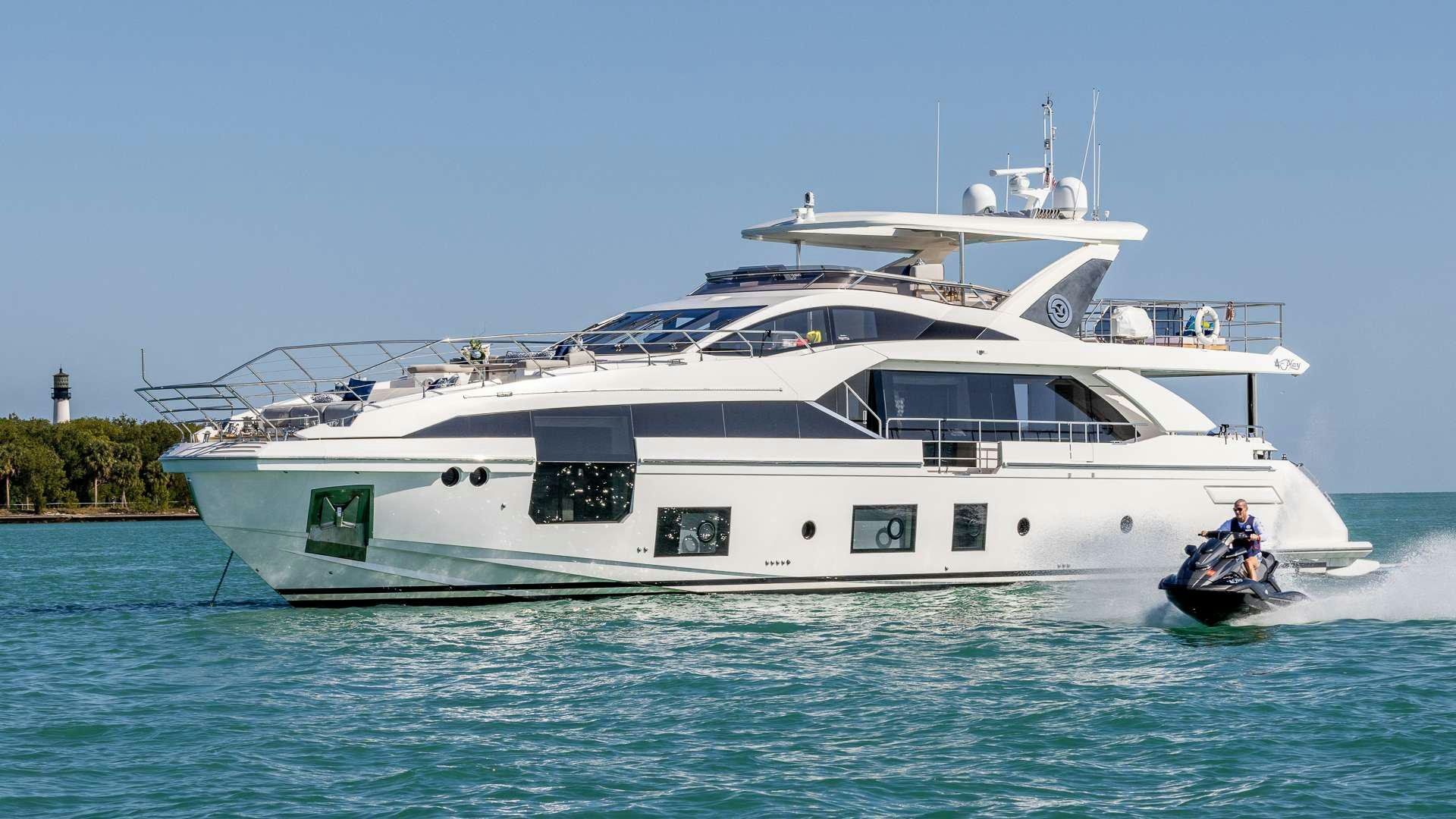 a white yacht on the water aboard 4 PLAY Yacht for Charter