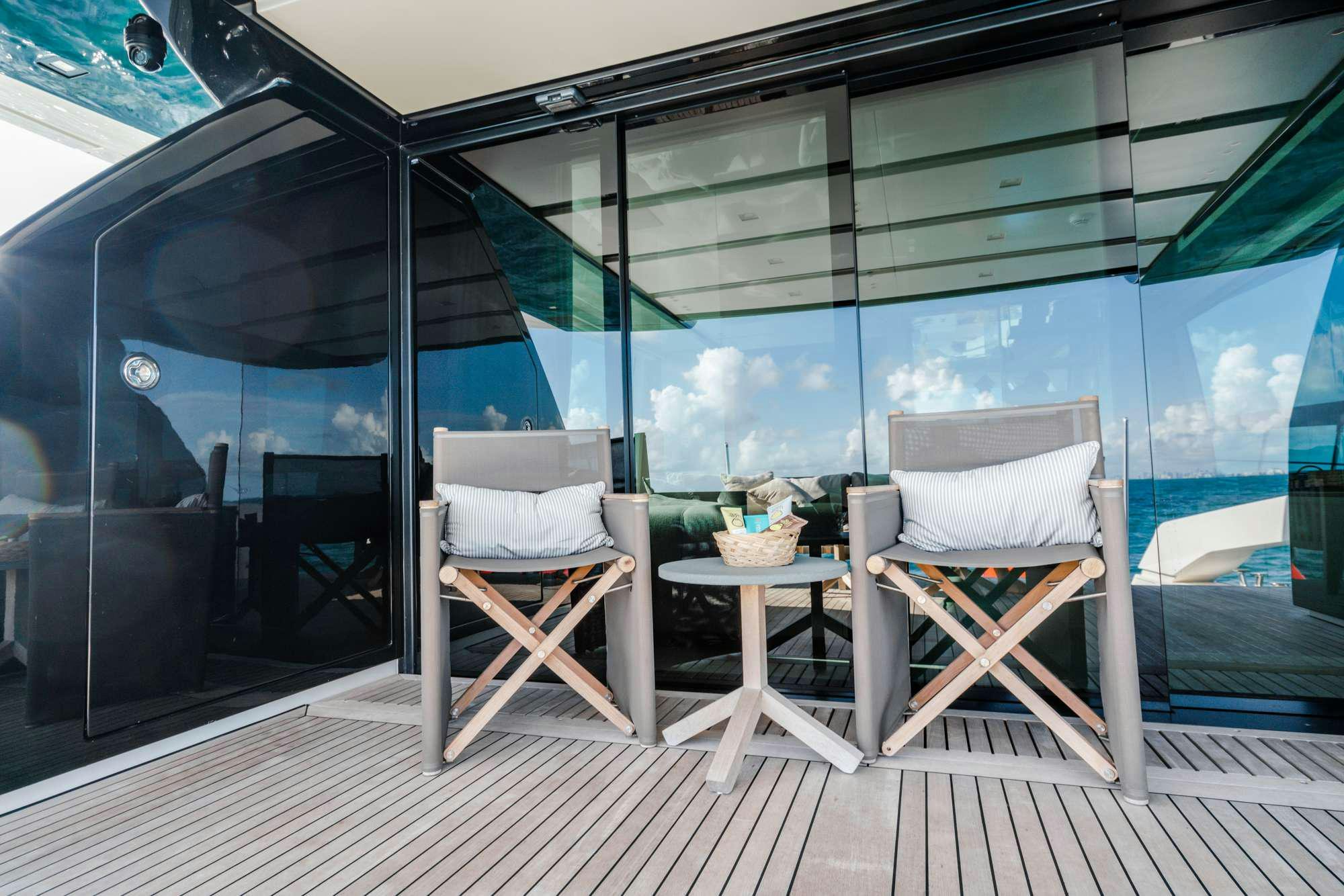 a room with a table and chairs aboard QUARANTENA Yacht for Charter