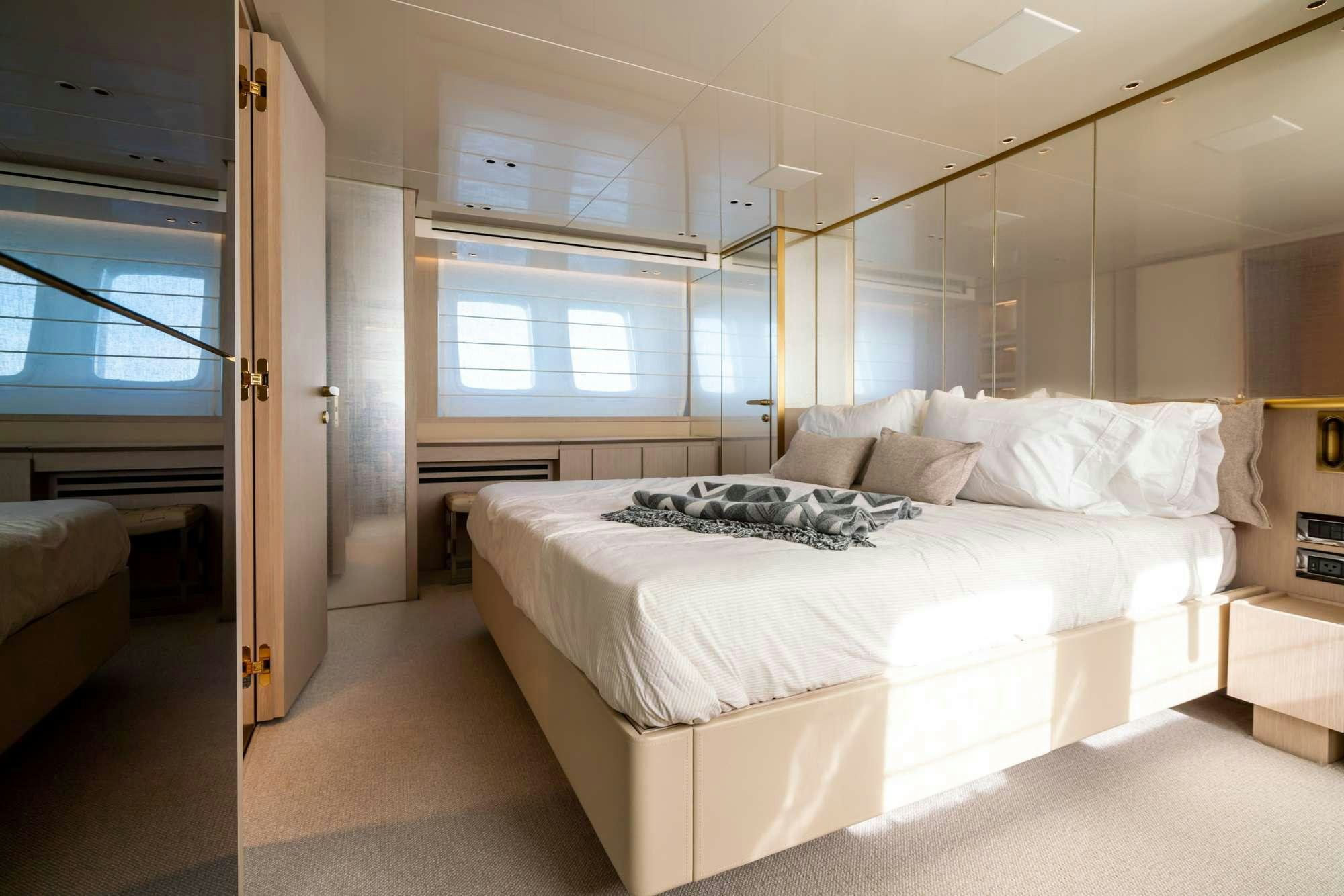 a room with a bed and a window aboard QUARANTENA Yacht for Charter