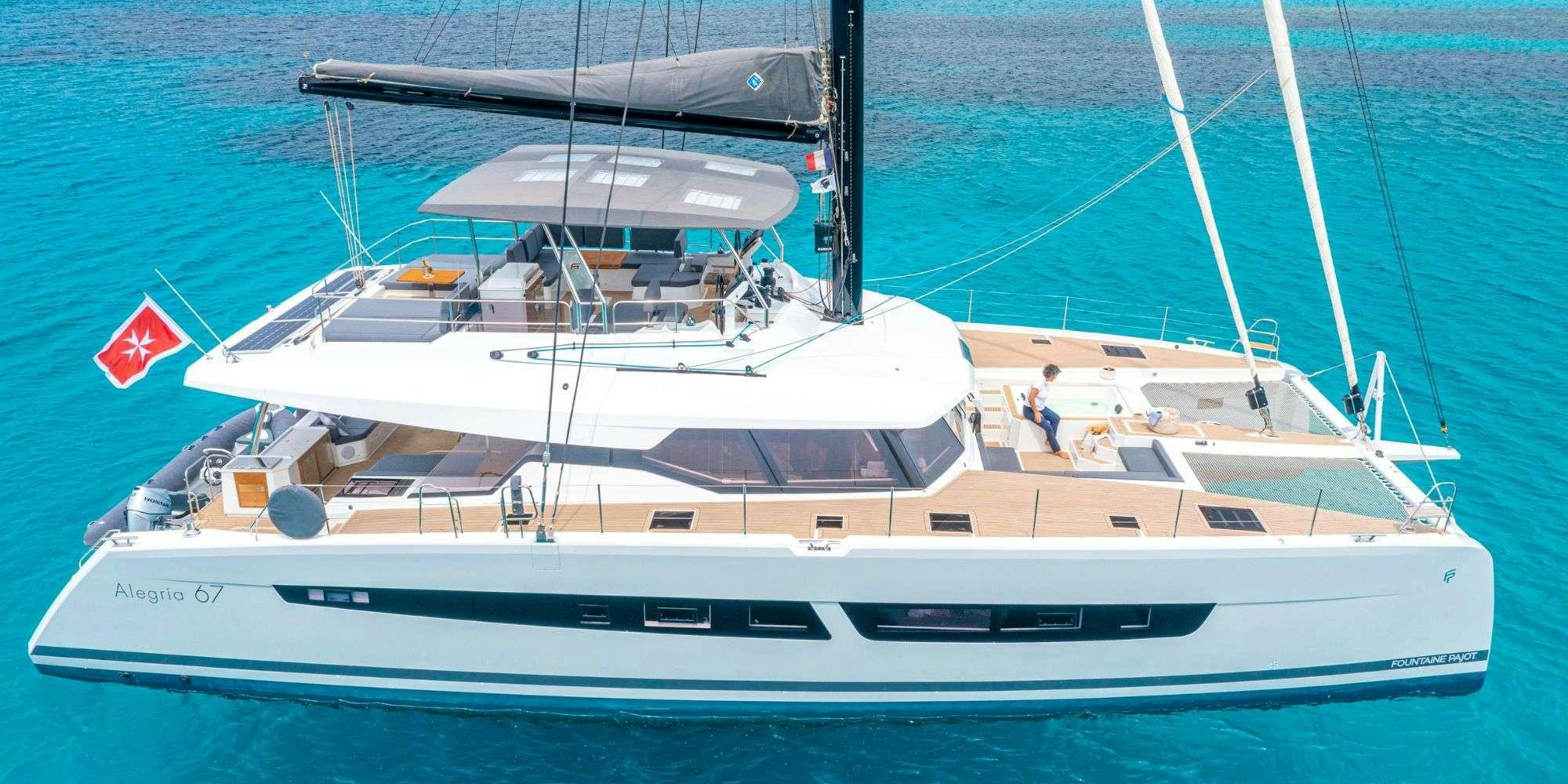 a white yacht on the water aboard SEMPER FIDELIS Yacht for Charter