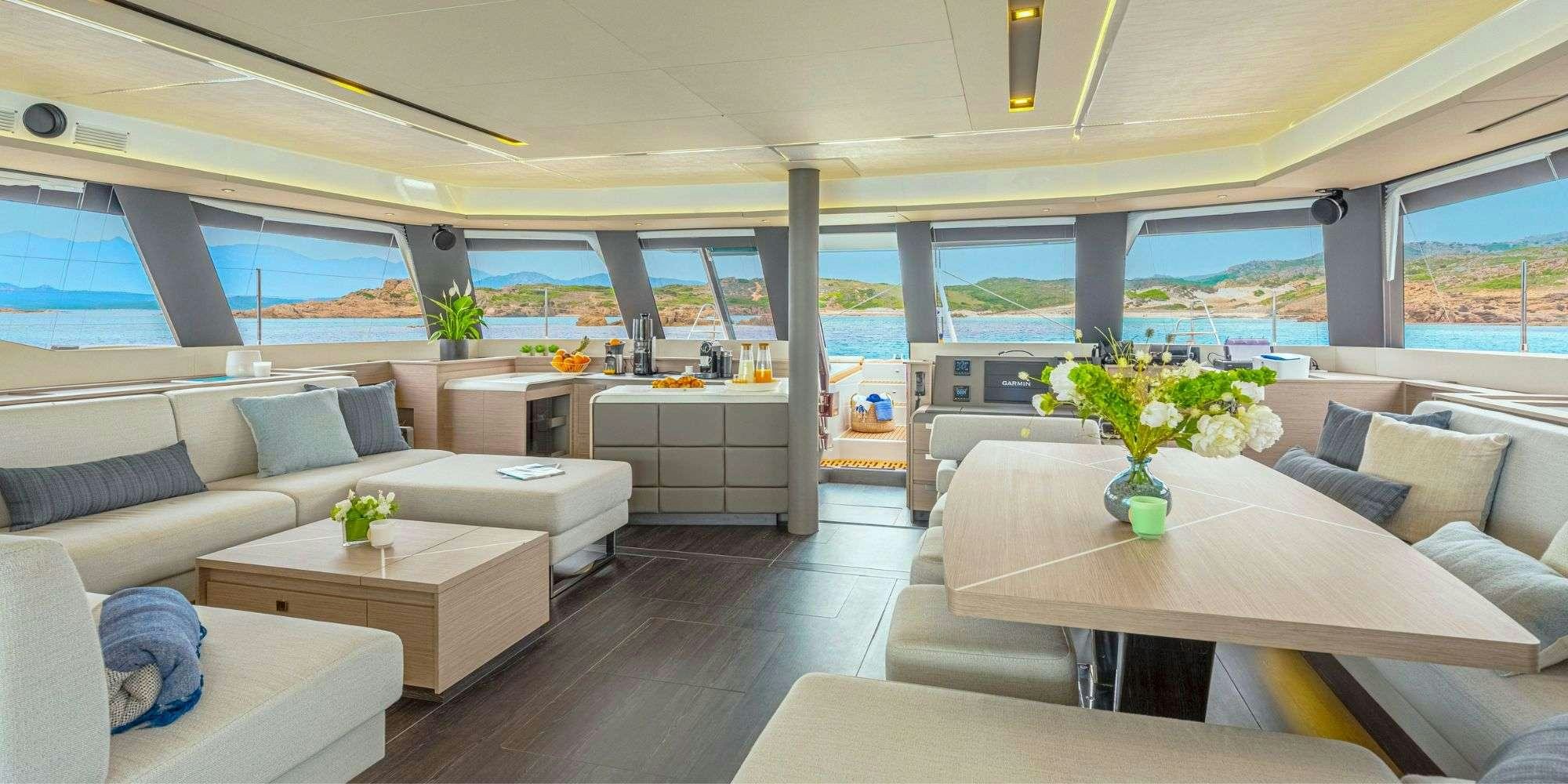 a living room with a large window aboard SEMPER FIDELIS Yacht for Charter