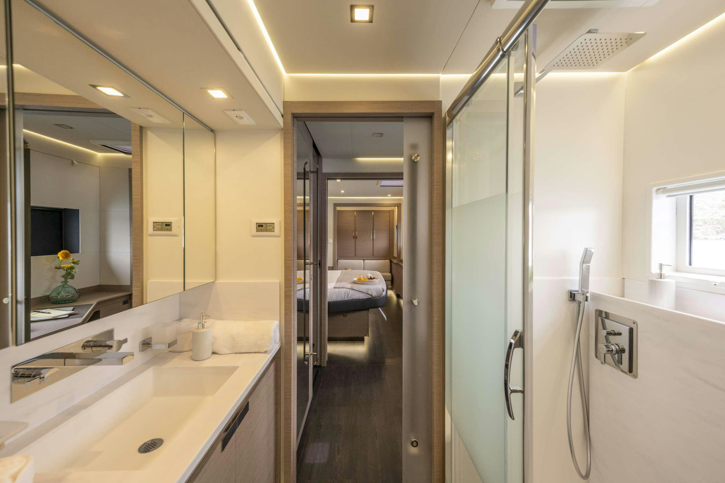 a bathroom with a sink and a bed aboard SEMPER FIDELIS Yacht for Charter