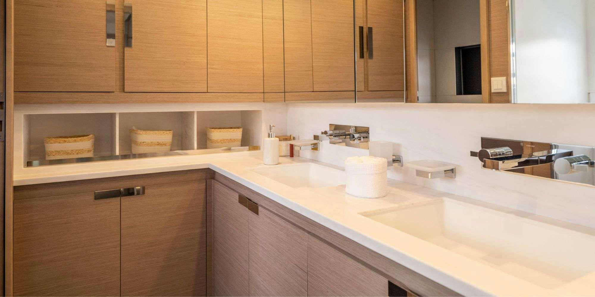 a kitchen with wooden cabinets aboard SEMPER FIDELIS Yacht for Charter