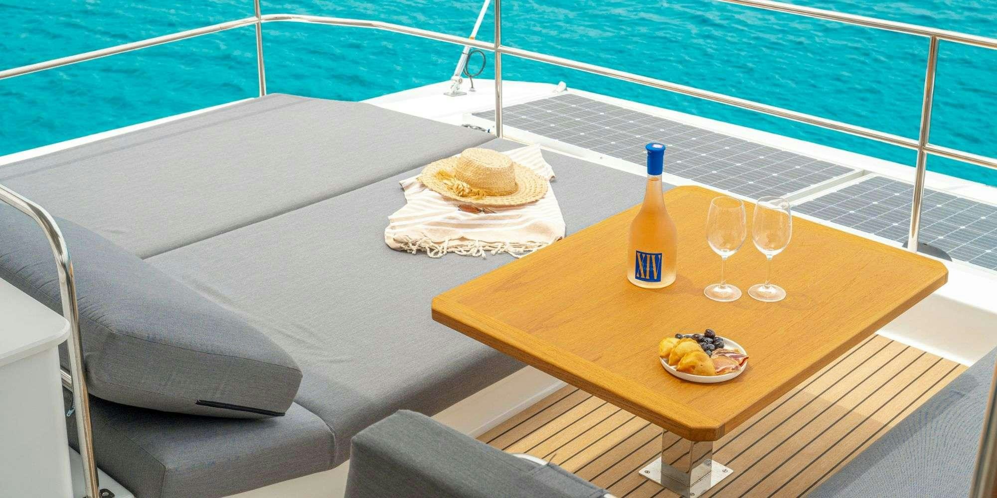 a table with food and drinks on it aboard SEMPER FIDELIS Yacht for Charter