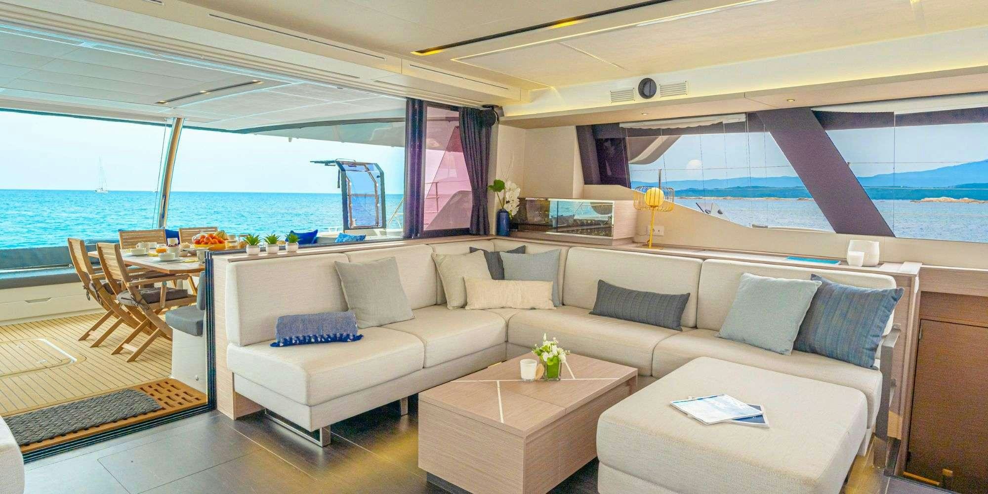 a living room with a couch and a table aboard SEMPER FIDELIS Yacht for Charter