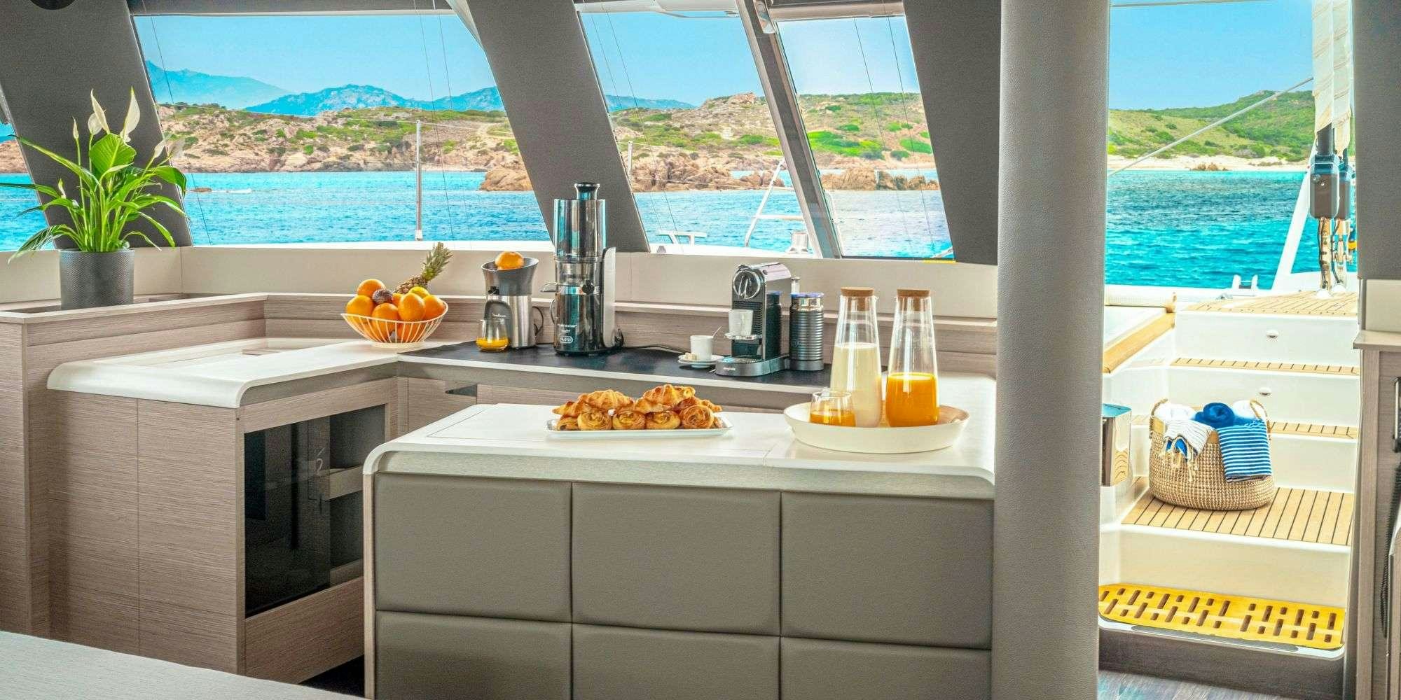 a kitchen with a view of the ocean aboard SEMPER FIDELIS Yacht for Charter