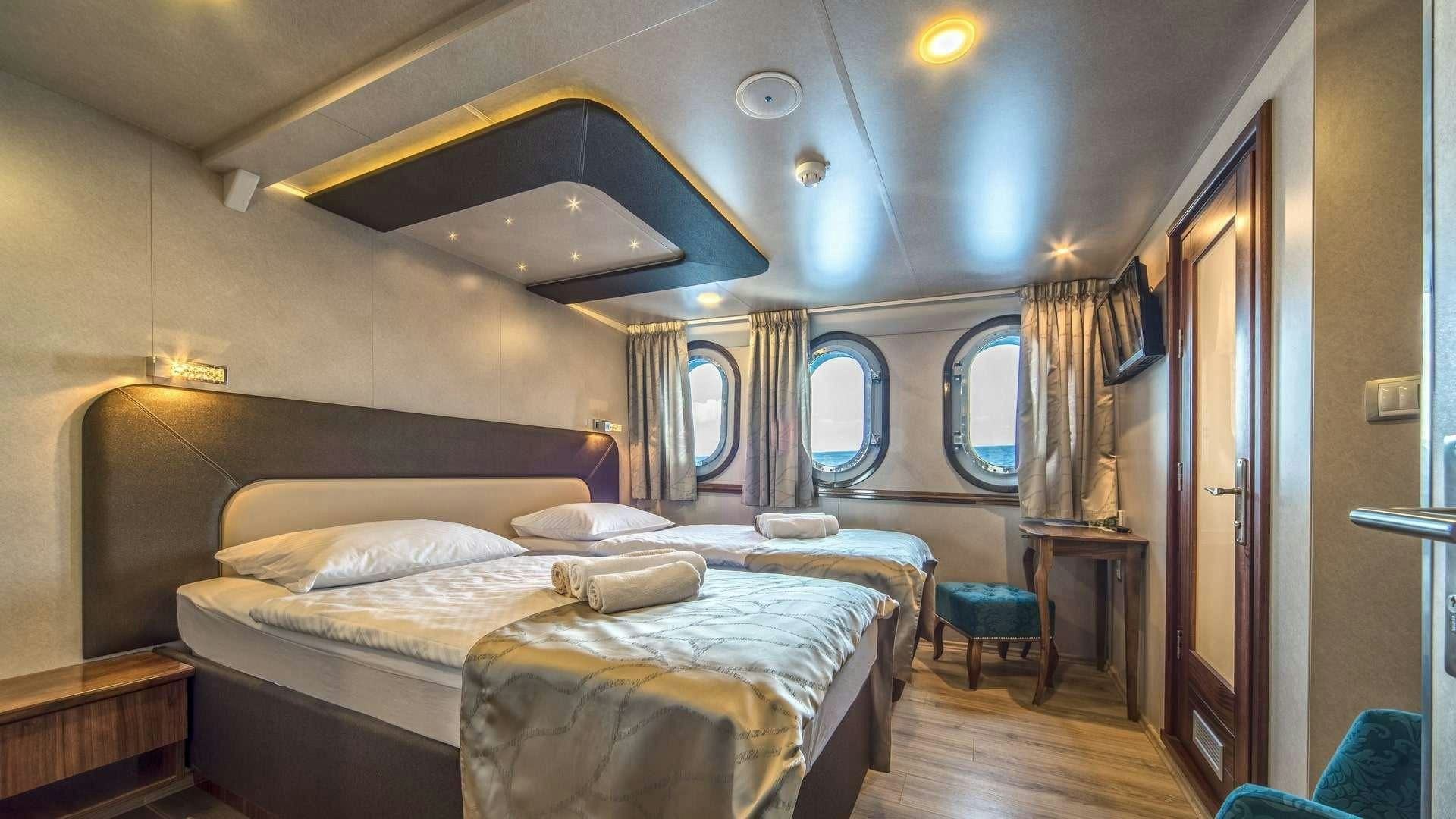 a room with two beds aboard CASABLANCA Yacht for Charter