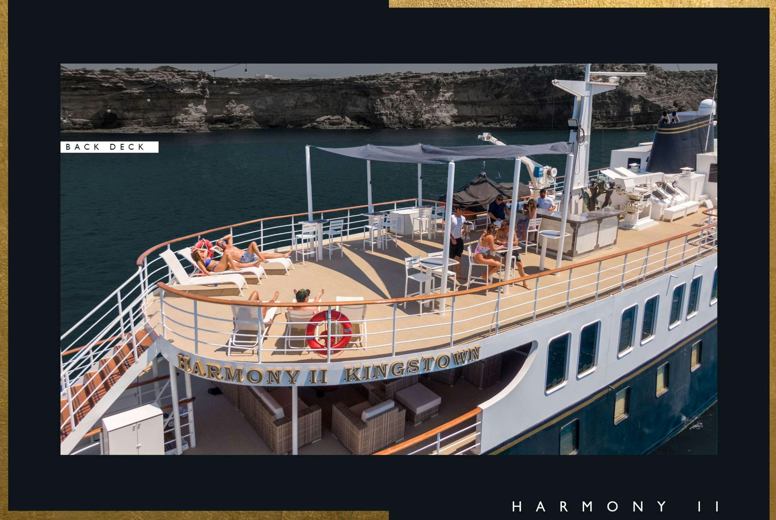 a large boat with people on it aboard HARMONY II Yacht for Charter