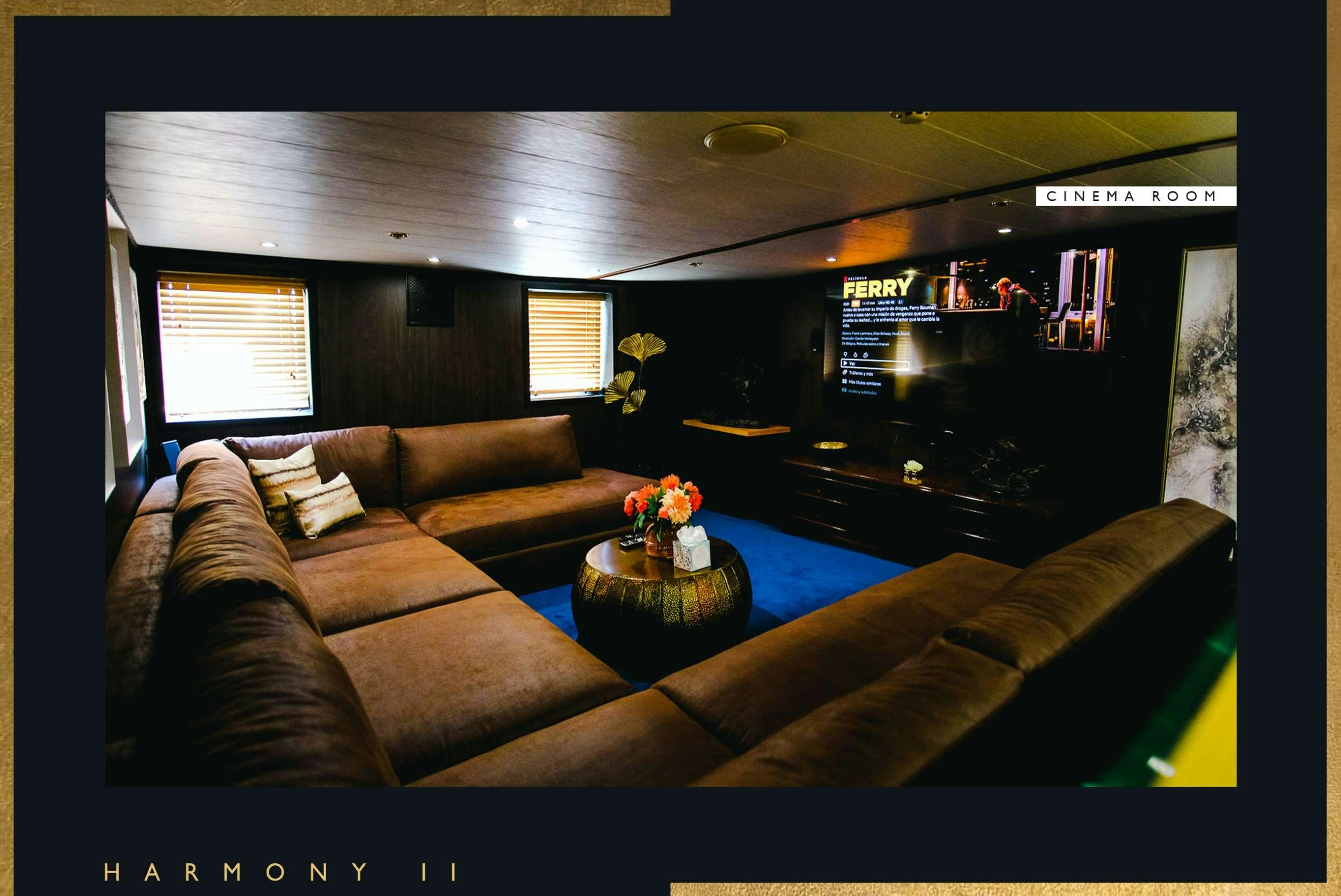 a living room with a couch and a coffee table aboard HARMONY II Yacht for Charter