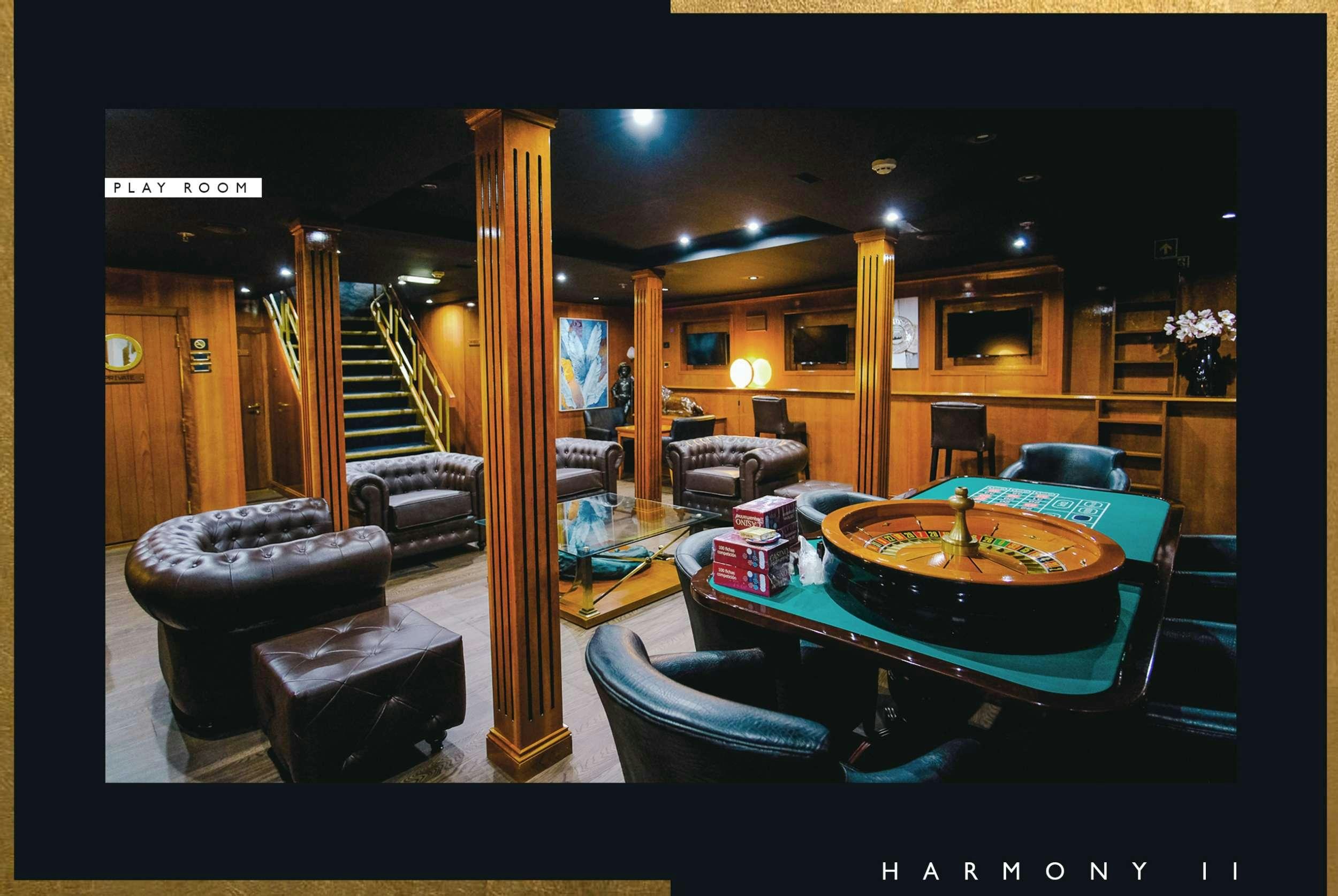 a pool table in a room aboard HARMONY II Yacht for Charter