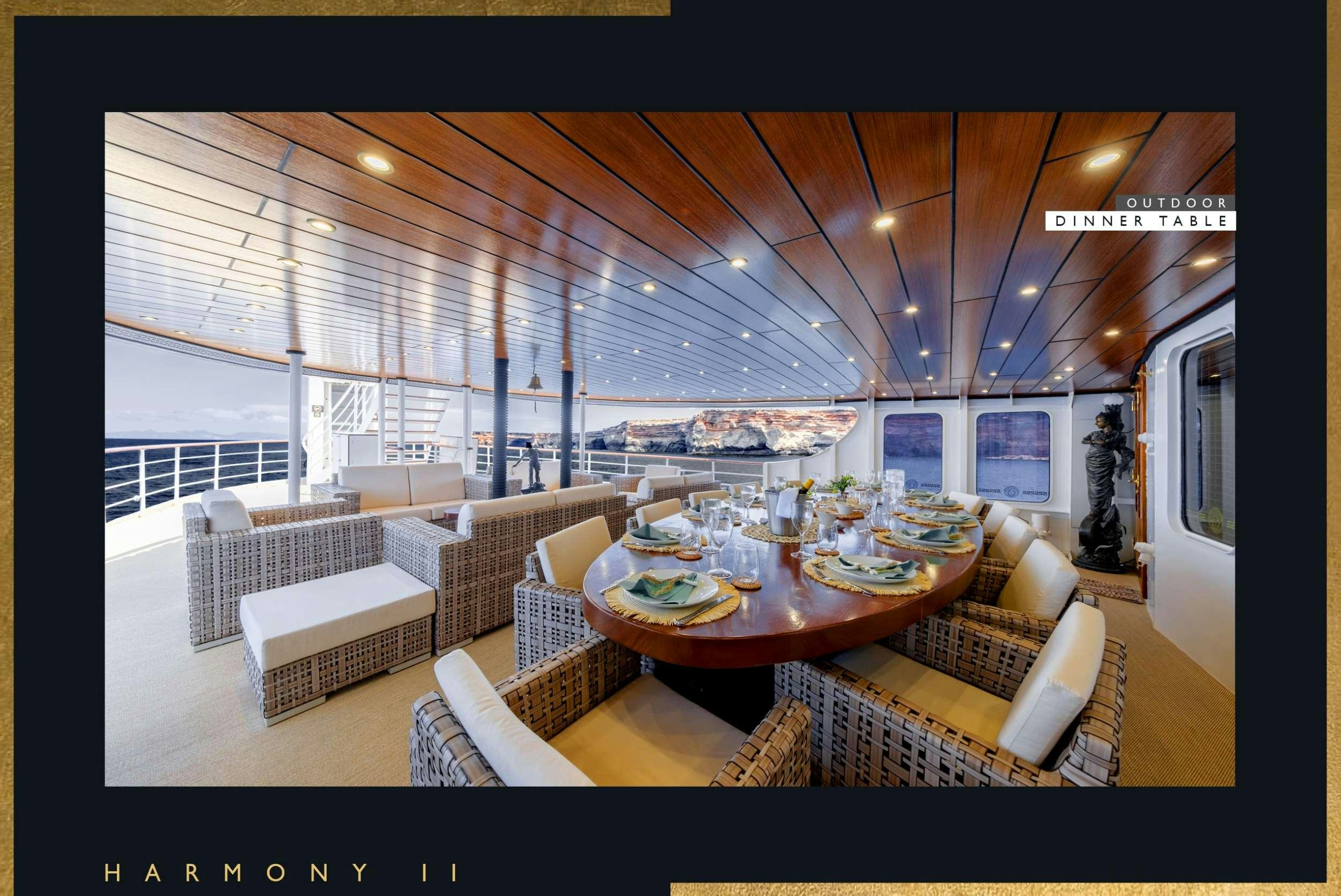 a living room with a large balcony aboard HARMONY II Yacht for Charter