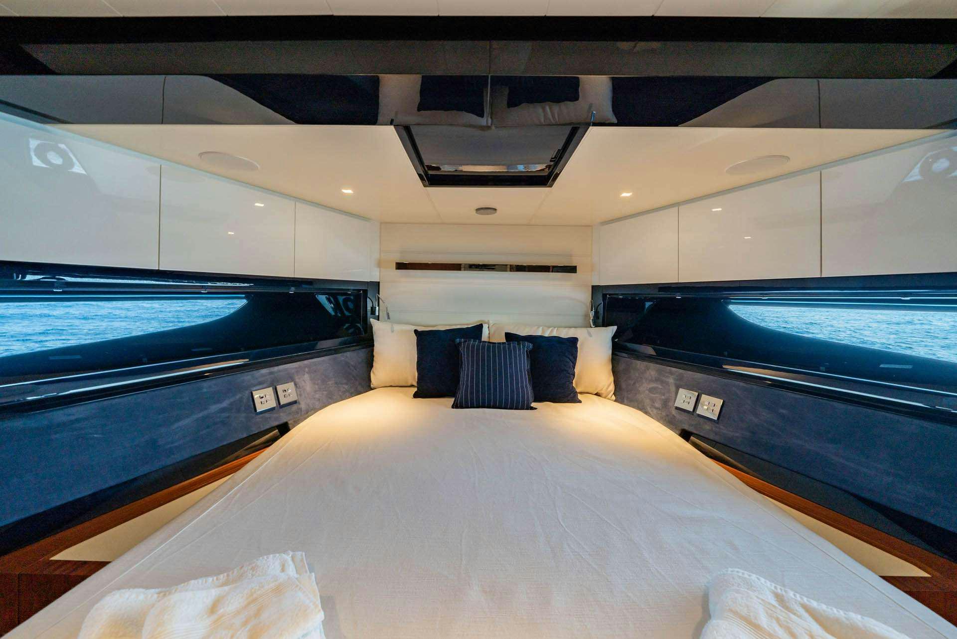 a bed in a room aboard BLUE SHARK Yacht for Charter