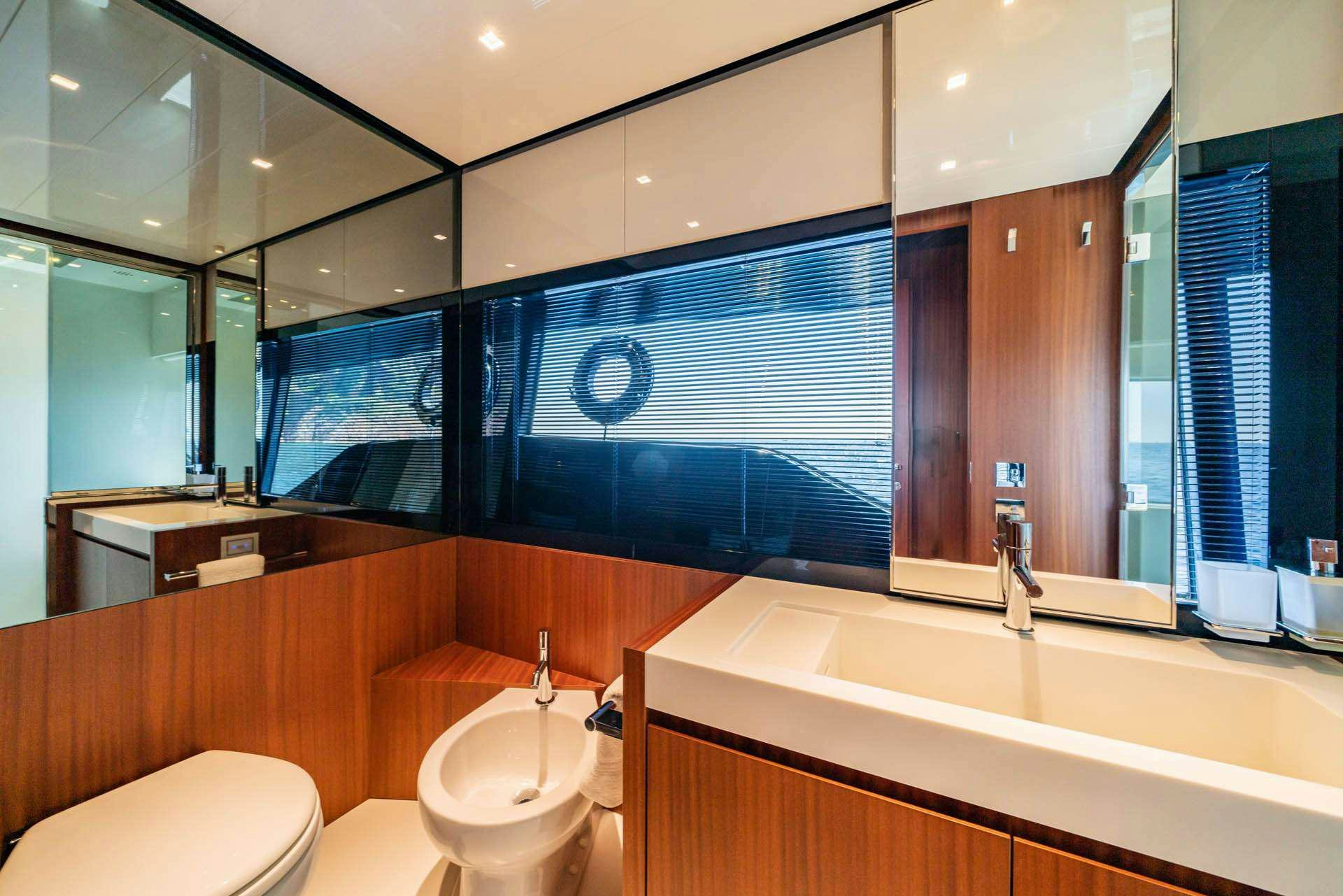 a bathroom with a large mirror aboard BLUE SHARK Yacht for Charter