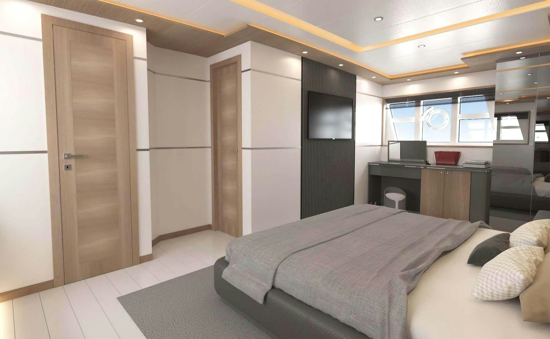 a bedroom with a bed and desk aboard LAVIN Yacht for Charter